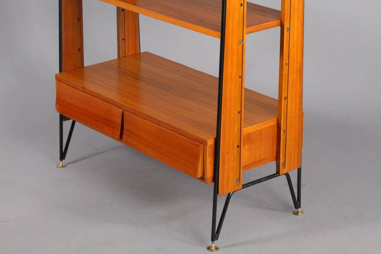 Mid-Century Italian wall unit,
tipo esposto al salone del monile Milano,
signed at the drawer,
Italy, 1950.
Two drawers, teakwood, black laquered metal,
brass shoes.
