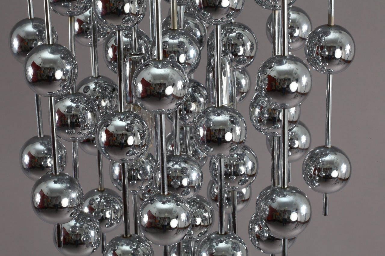 Verner Panton for J. Lüber,
a 'Ball' chandelier,
designed 1970 formed from a series of chromed metal balls suspended from steel rods.
four bulb sockets each max.60 watt.
