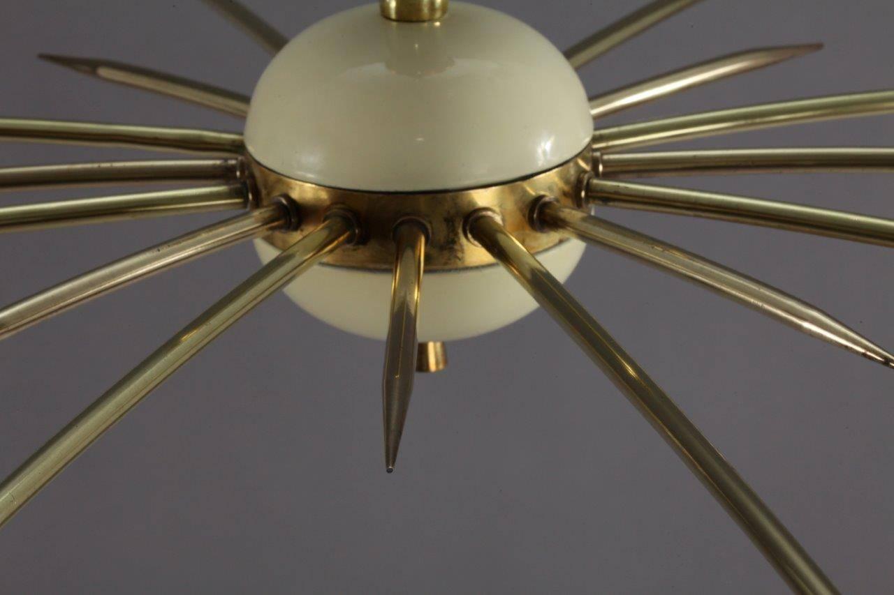 Sputnik chandelier,
Stilnovo, Italy, 1950.
Crème enameled cones,
eight bulb sockets E 14 max. 60 watt.
The length of the stem can be altered to any size for free