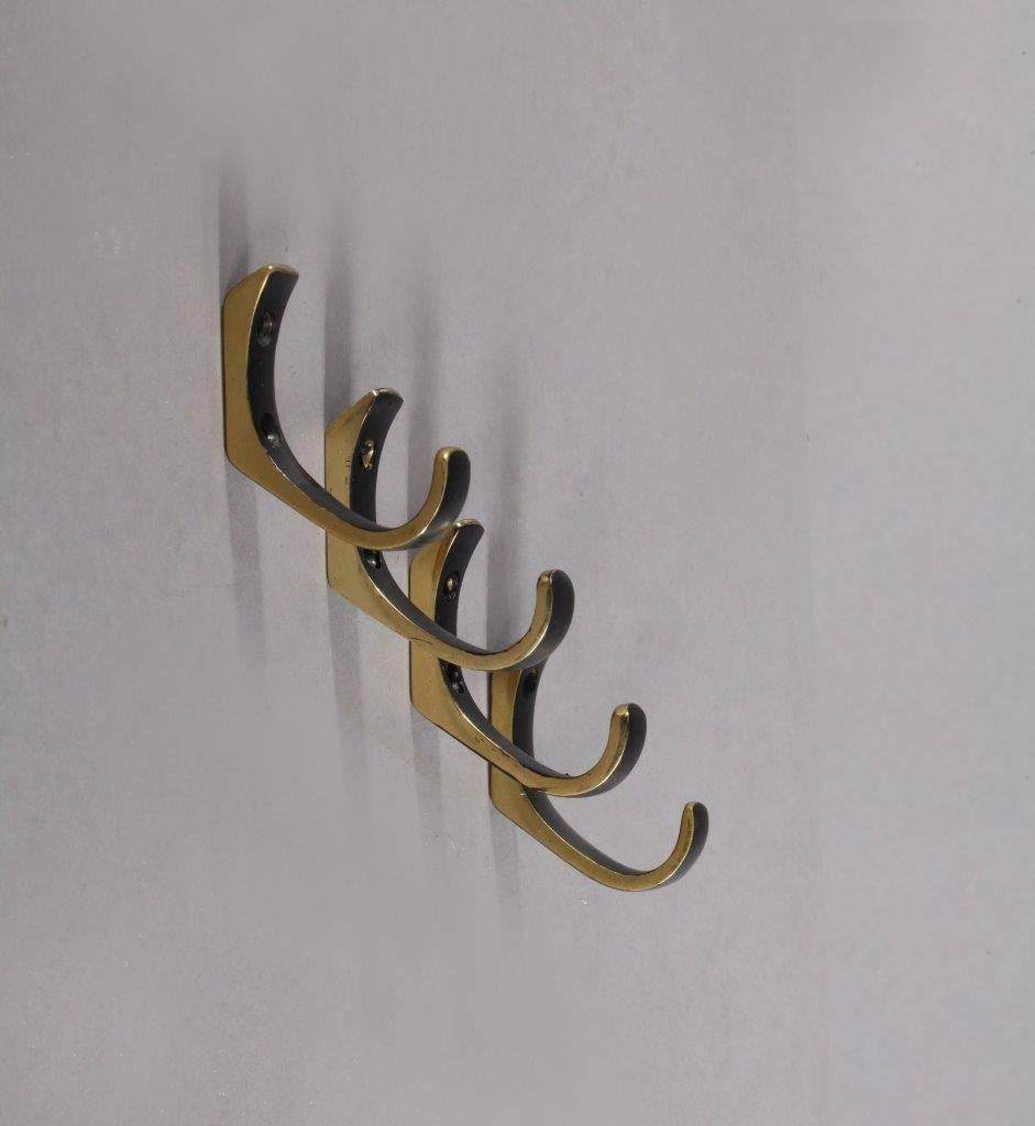 A set of four beautiful Austrian brass hooks by Hertha Baller, Austria, 1950s. In the style of Carl Auböck. They are made of blackened and partly polished brass. Lovely patina.

There are further hooks in the same style but in different shapes