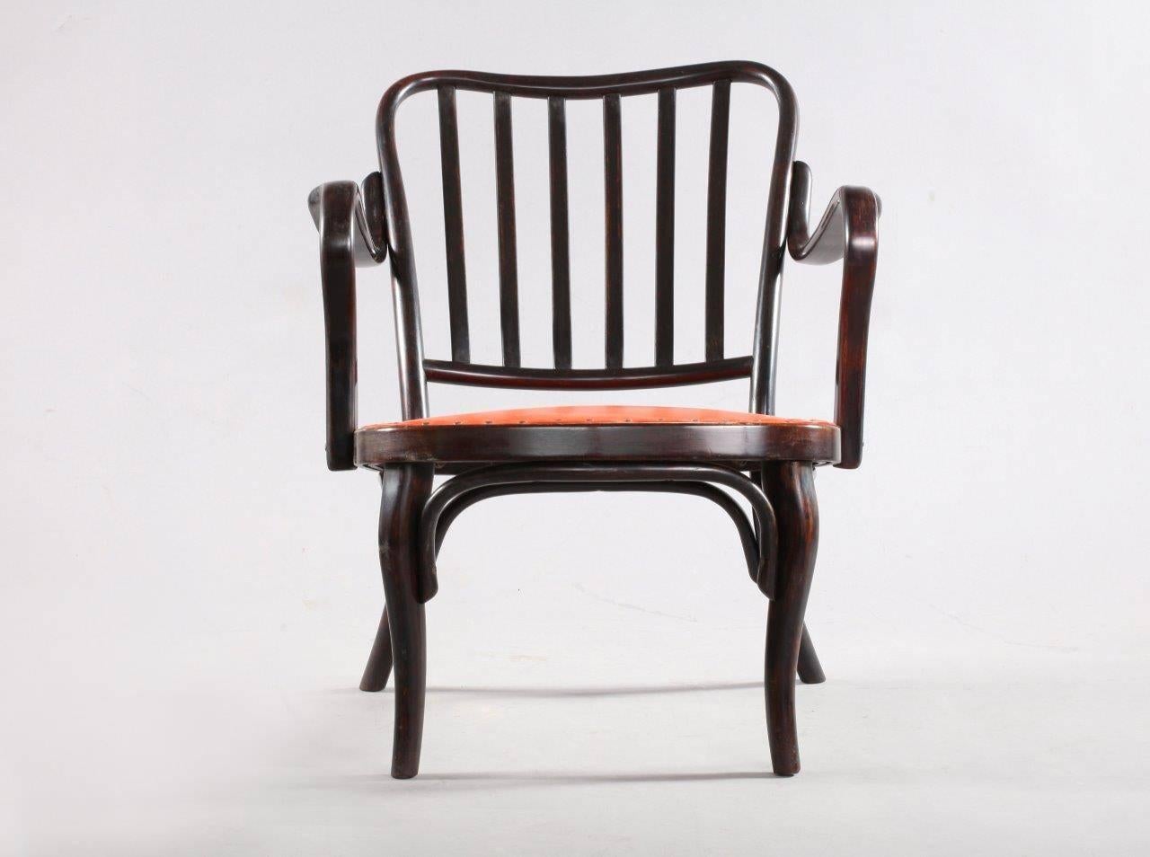 These A 752 armchair were designed 1930 by Josef Frank. Manufactured by Thonet, Vienna, 1960. Dark brown bentwood, seat upholstered in red leather.
 