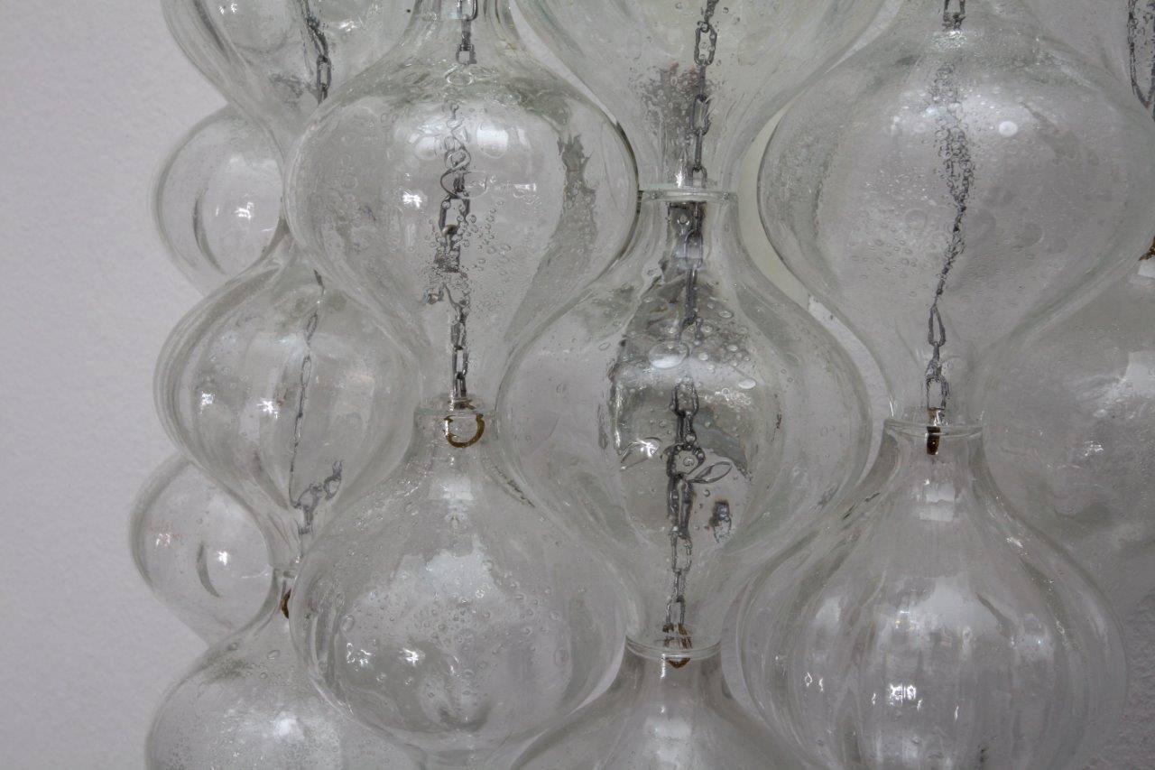 Pair of wall sconces, J.T.Kalmar, Vienna, 1960. Crystal glass, laquered metal. Two bulb sockets E 14 each max. 60 watt.