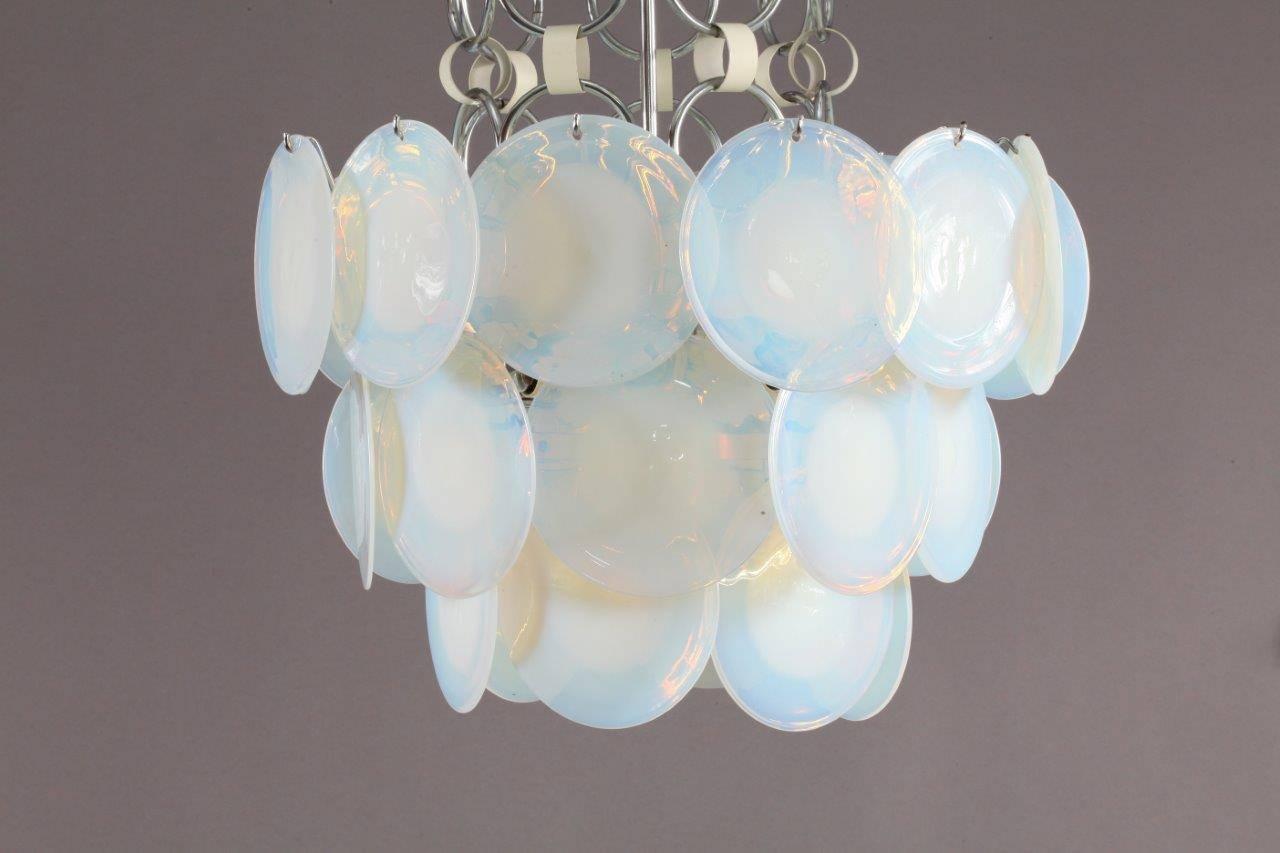 Murano chandelier,
Gino Vistosi,
Murano, 1970s
24 handmade glass discs.
Six bulb sockets E24 each max. 75watt.
The overall hanging height can be adjusted to suit.