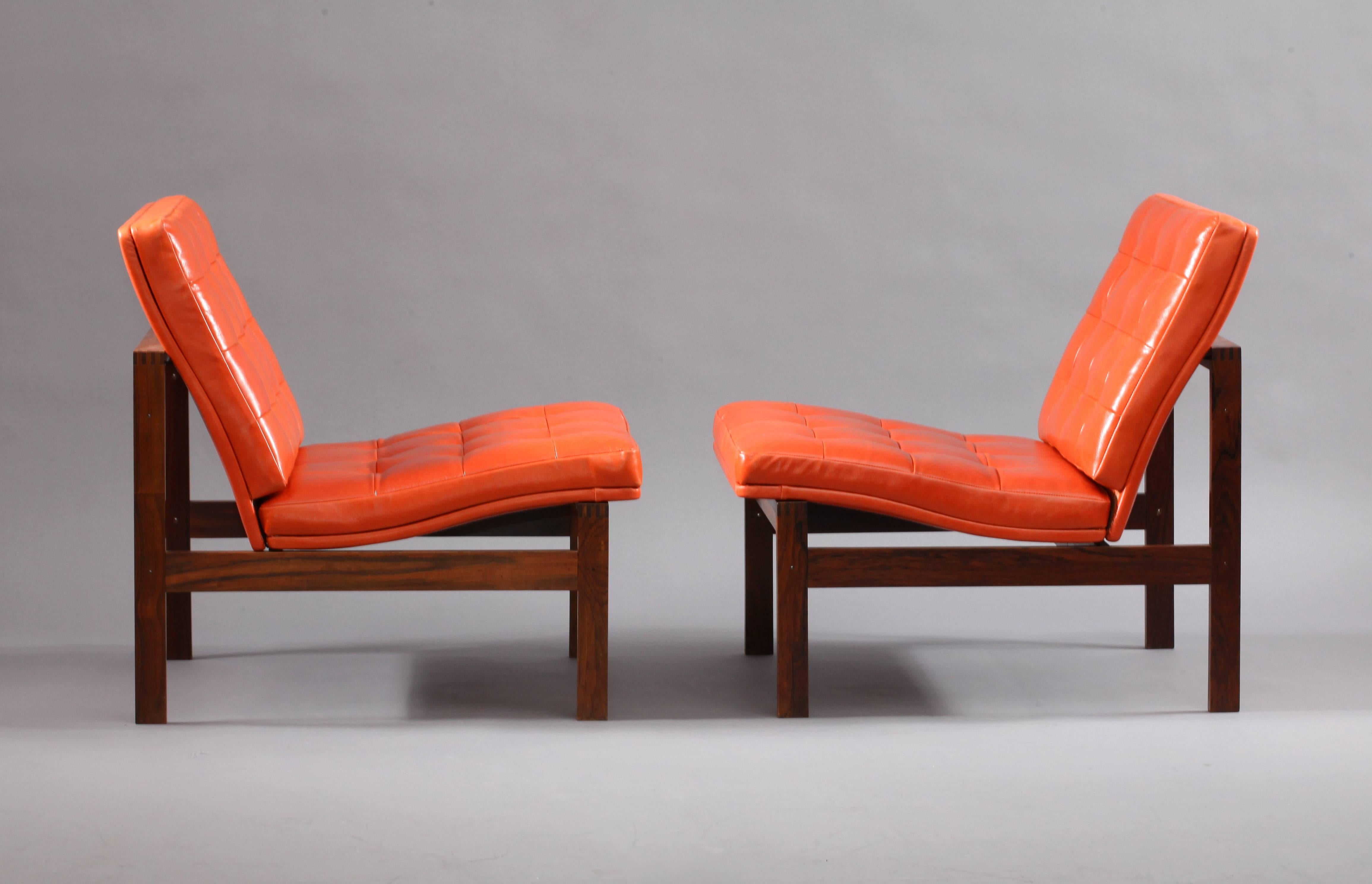 A pair of Danish modular easy chairs designed by Torben Lind and Ole Gjerløv-Knudsen, for France and Son, Denmark, 1974
Rosewood with orange leather upholstery in excellent condition. Seat cushions were removed from the frame.
  