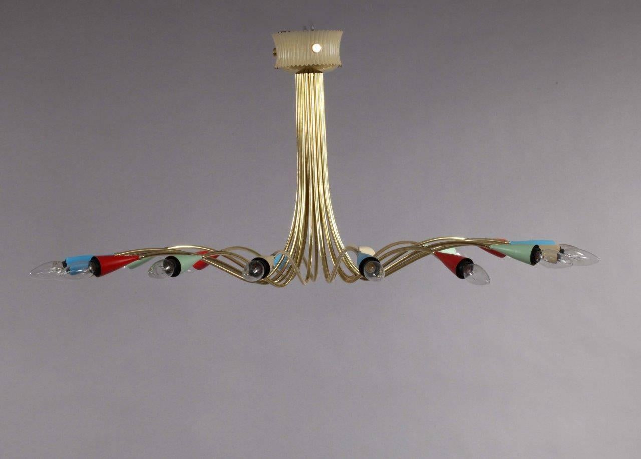 Sputnik ceiling lamp,
Arredoluce,
Italian, 1950.
16 brass arms with colorful cones.