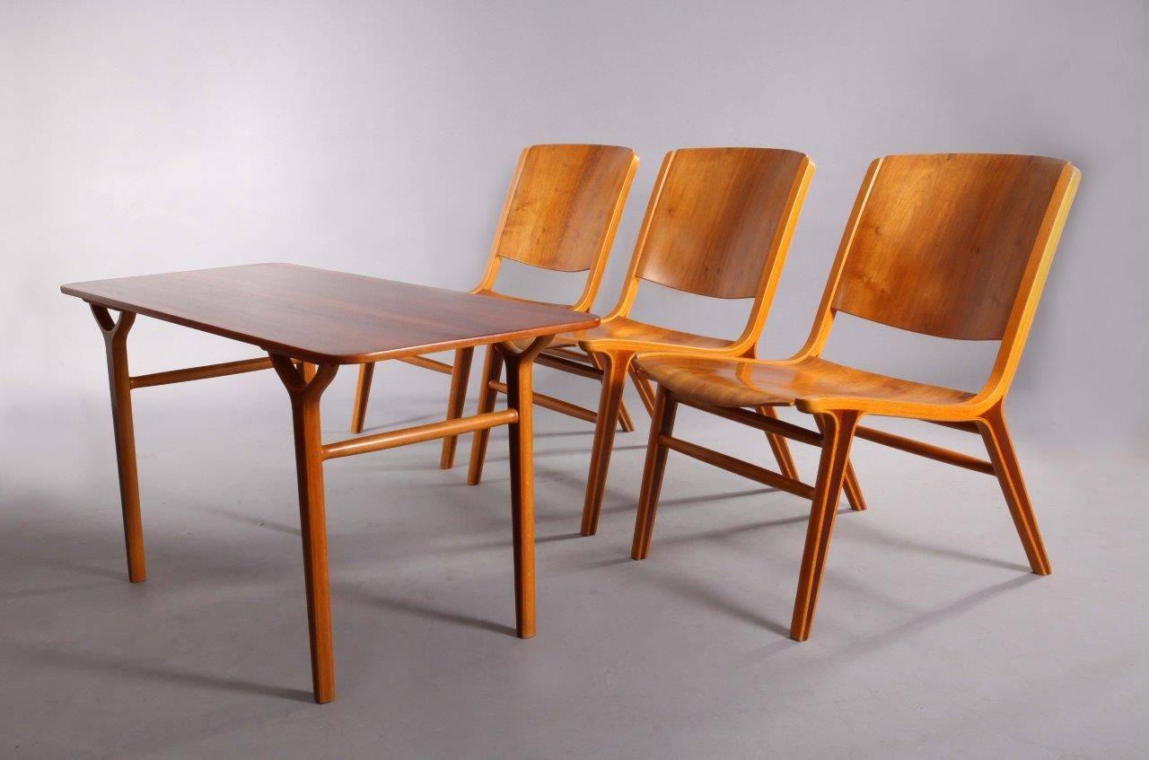 Three Classic 'AX' chairs and rectangular table designed by Peter Hvidt & Orla Mølgaard Nielsen for Fritz Hansen in 1950. This chair features a birch ply frame with inset mahogany in the legs and a bent teak back and seat.
measurement