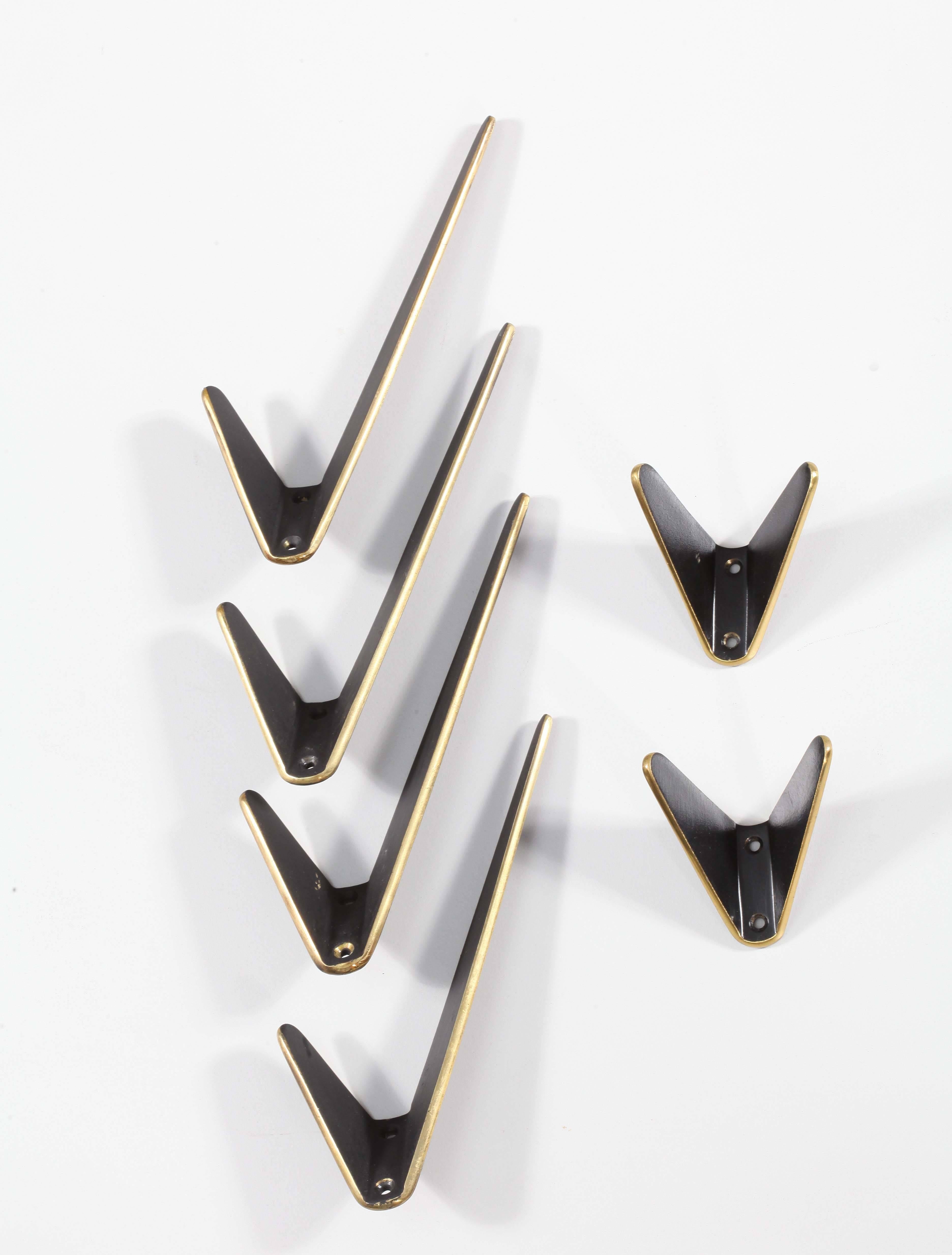 Four asymmetric and two small wall hooks, 
Hertha Baller, Austria, 1950
Brass, black laquered.
 