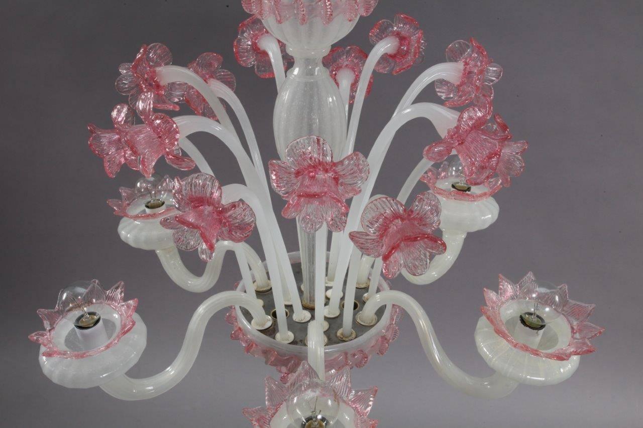 Handblown Classic pink and white Murano glass chandelier from Italy, circa 1940. Newly rewired with UL listed parts and six candelabra sockets. Features six handblown pink glass flowers on stems! Comes with brass chain and brass canopy!
One arm and