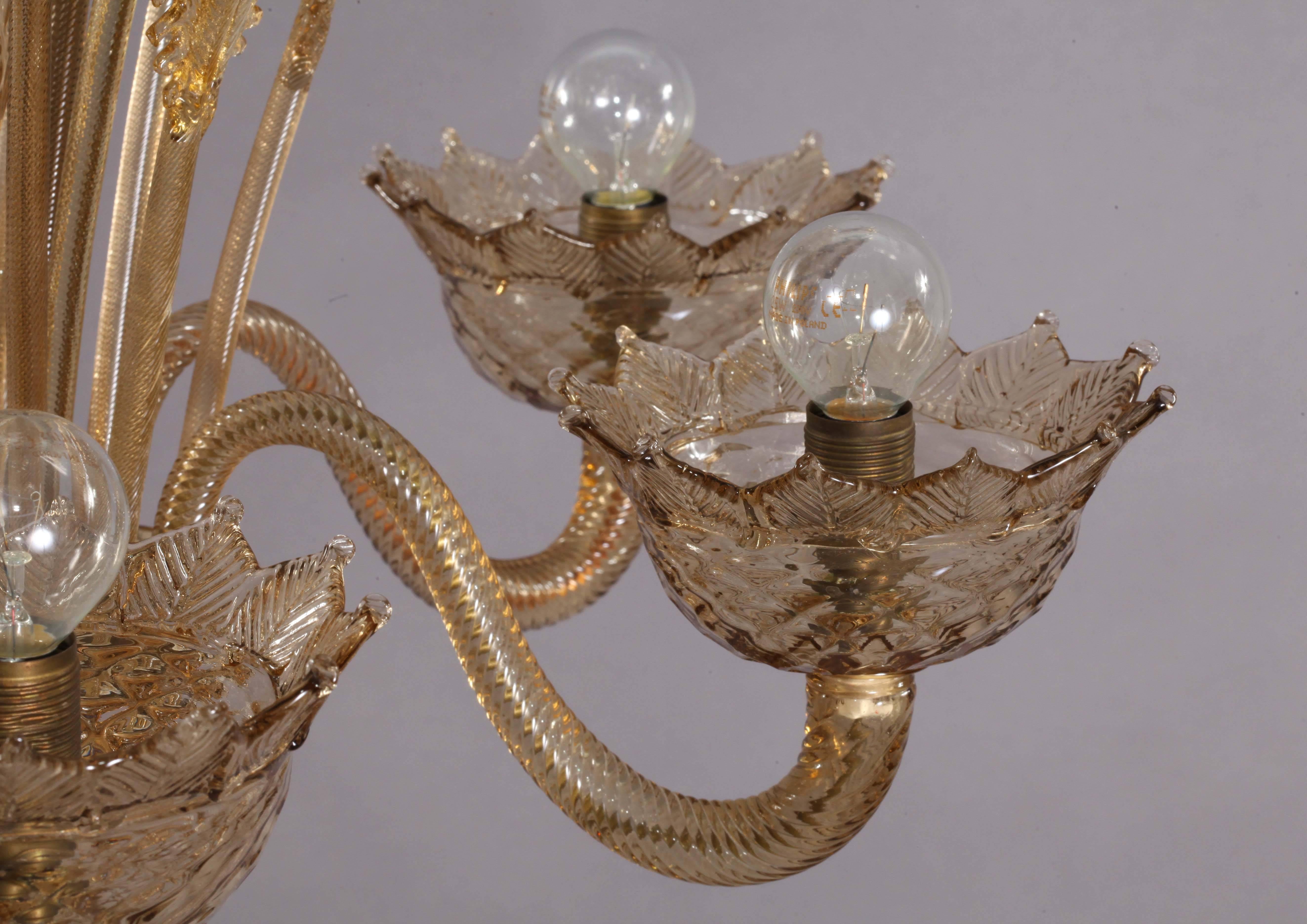 Handblown Classic honey Murano glass chandelier from Italy, circa 1940. Newly rewired with UL listed parts and six candelabra sockets. Features three handblown honey glass flowers and three glass leaves on stems!
Comes with one flower stem and one