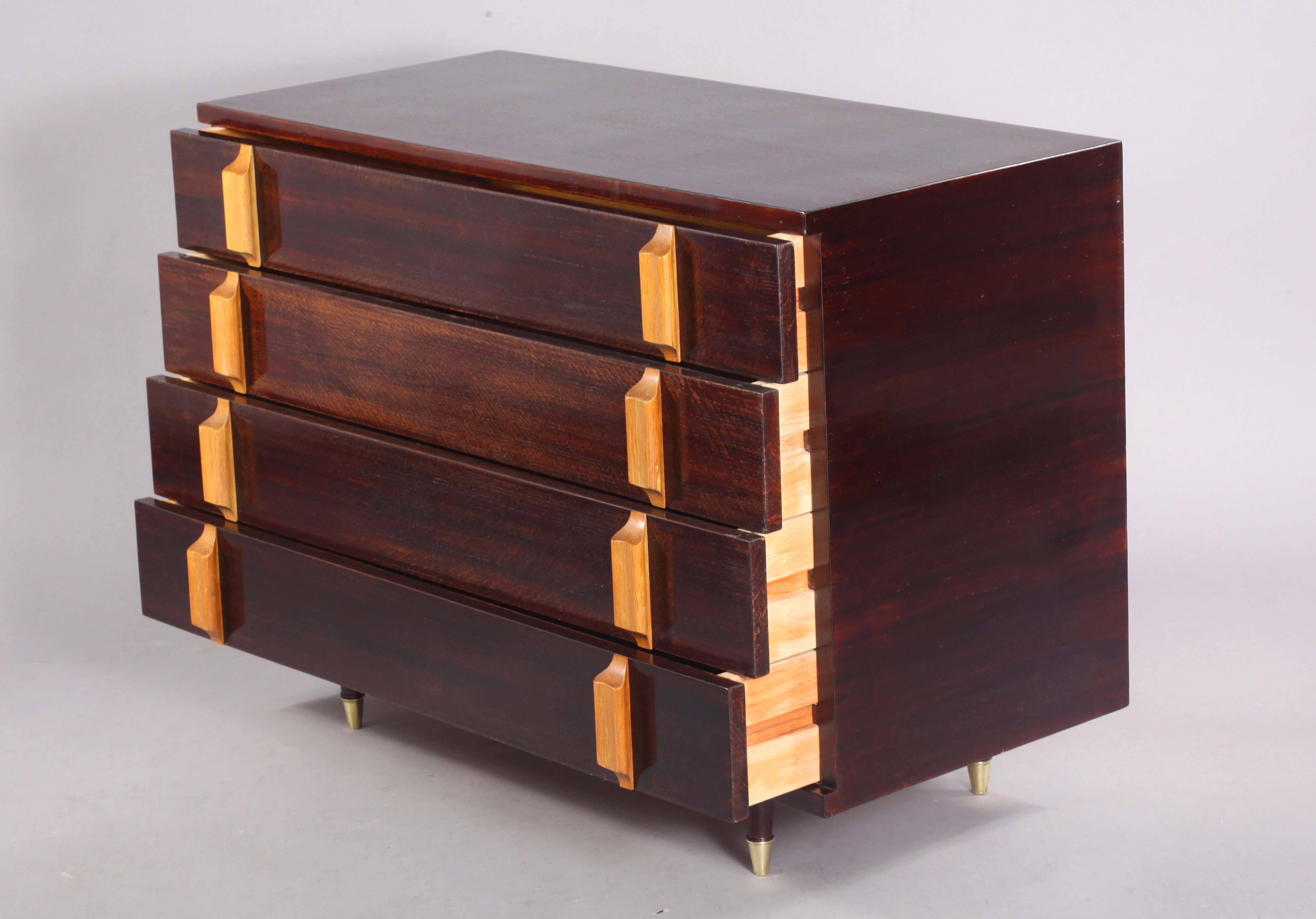 Chest of drawer,
Italy, 1950
dark walnut
two colors, four drawers, brass shoes.