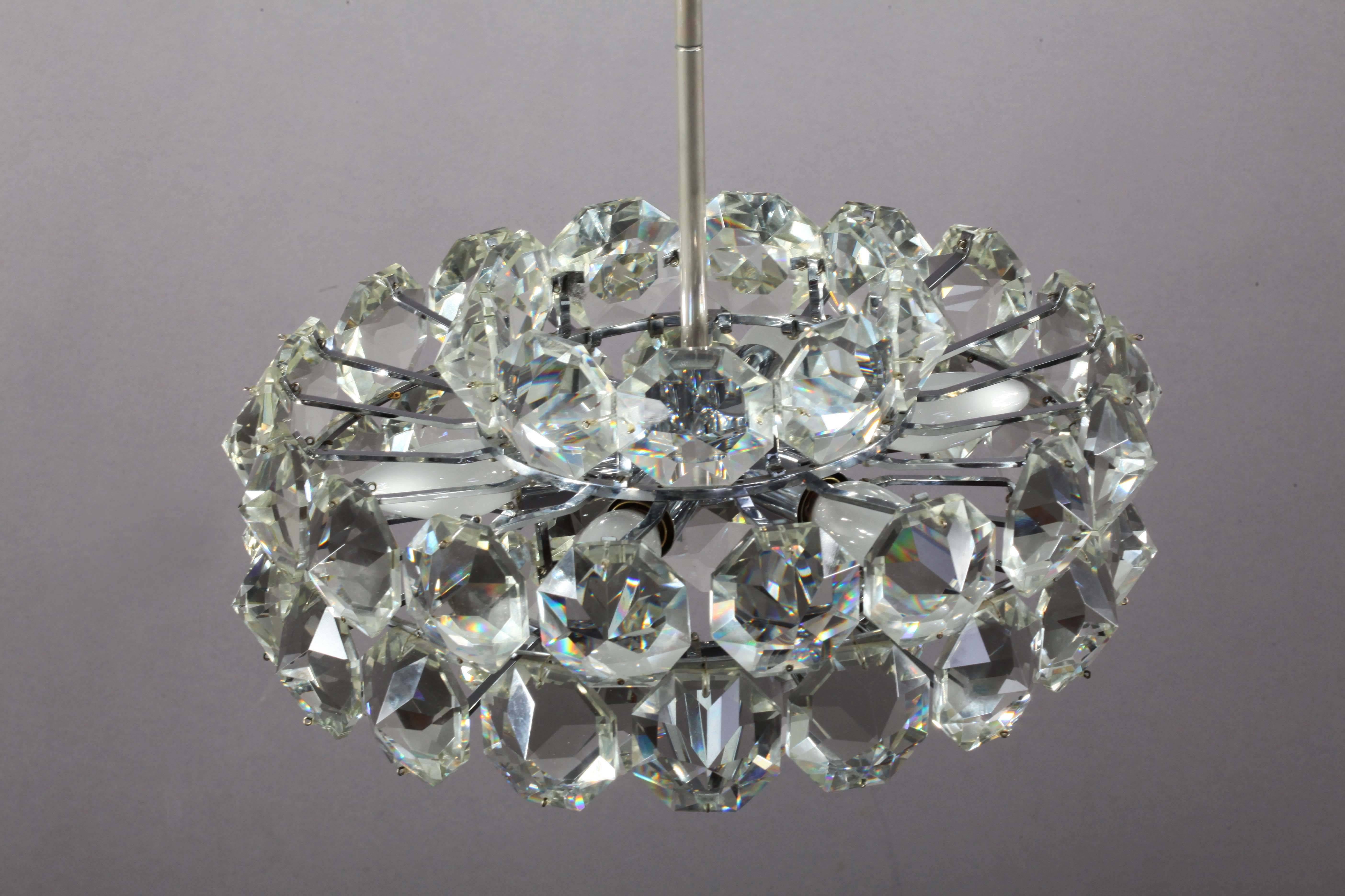 Gorgeous chandelier by Bakalowits & Sohne featuring a multitude of very uniquely sized large (each 6.5 x 6.5 cm) and exquisite with big sparkling octagon gem-like crystals hanging from a nickeled brass frame. Six bulbs are illuminating this
