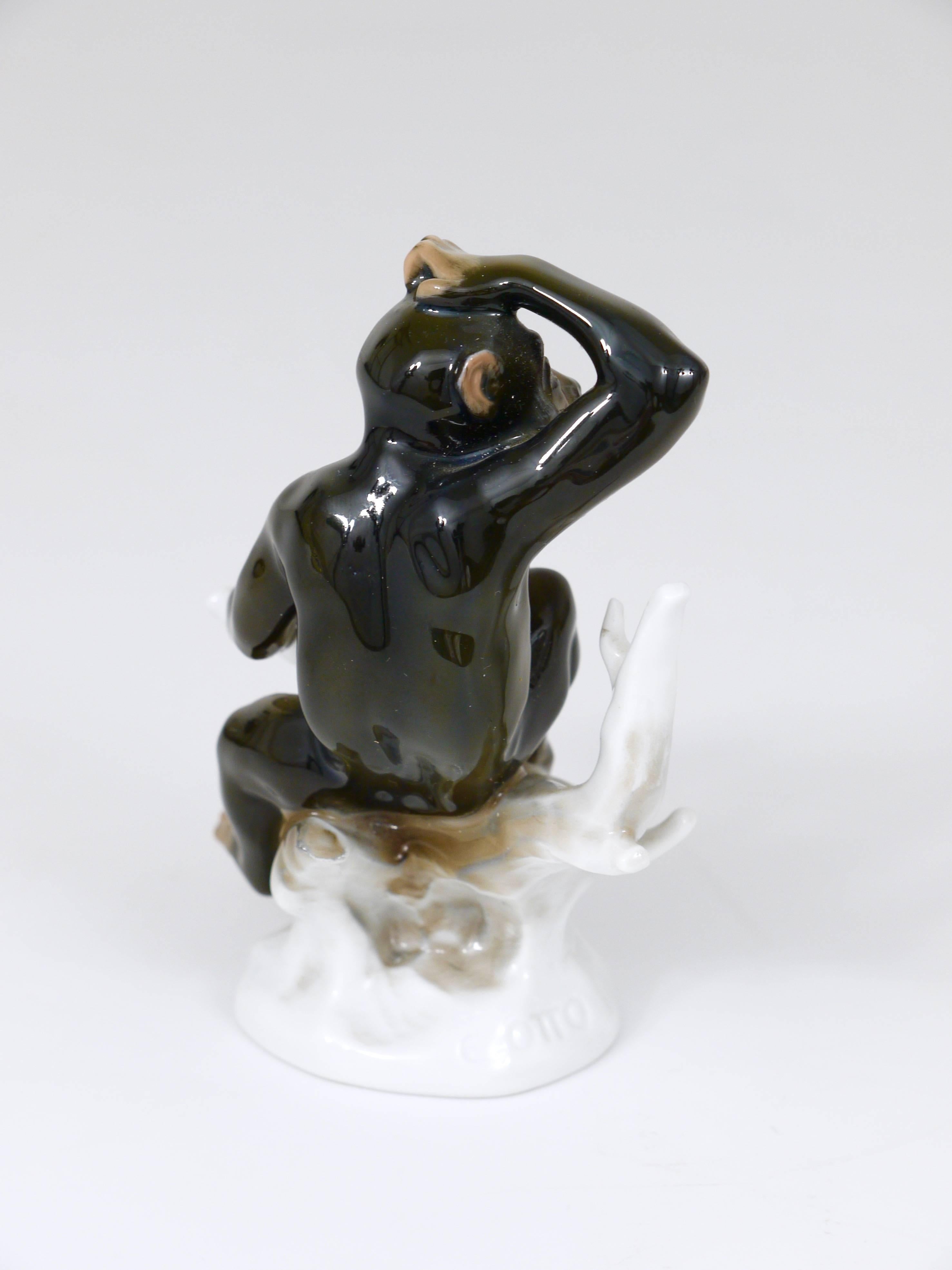 An unusual porcelain figurine displaying a chimpanzee sitting on a tree branch. This figurine was designed by Otto Eichwald and manufactured in the 1920s by Rosenthal Germany, Kunstabteilung Selb. In excellent condition. 

