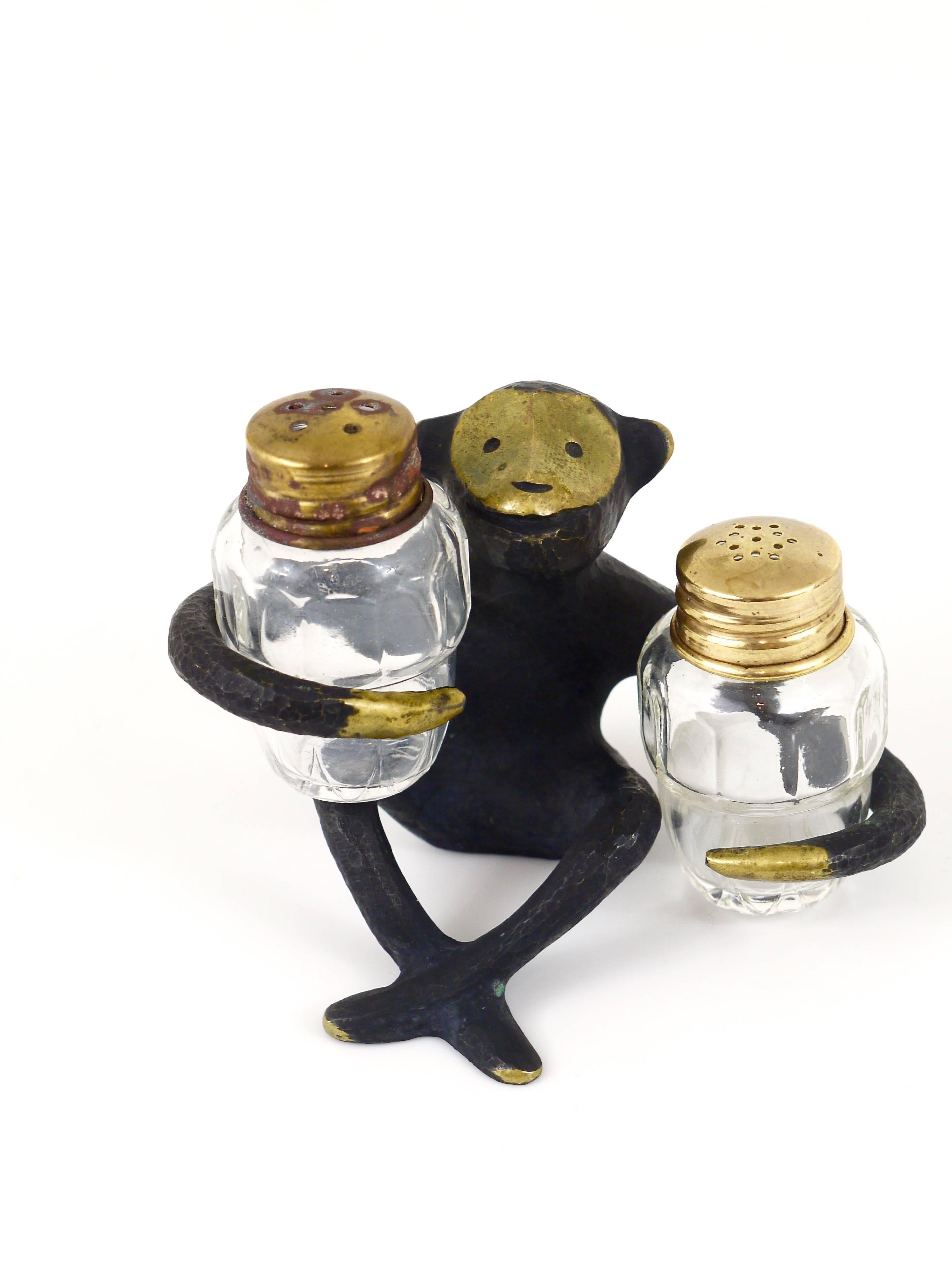 A very charming Austrian shaker set, displaying a monkey. A very humorous design by Walter Bosse, manufactured by Baller Austria in the 1950s. Made of brass, in very good condition with nice patina.