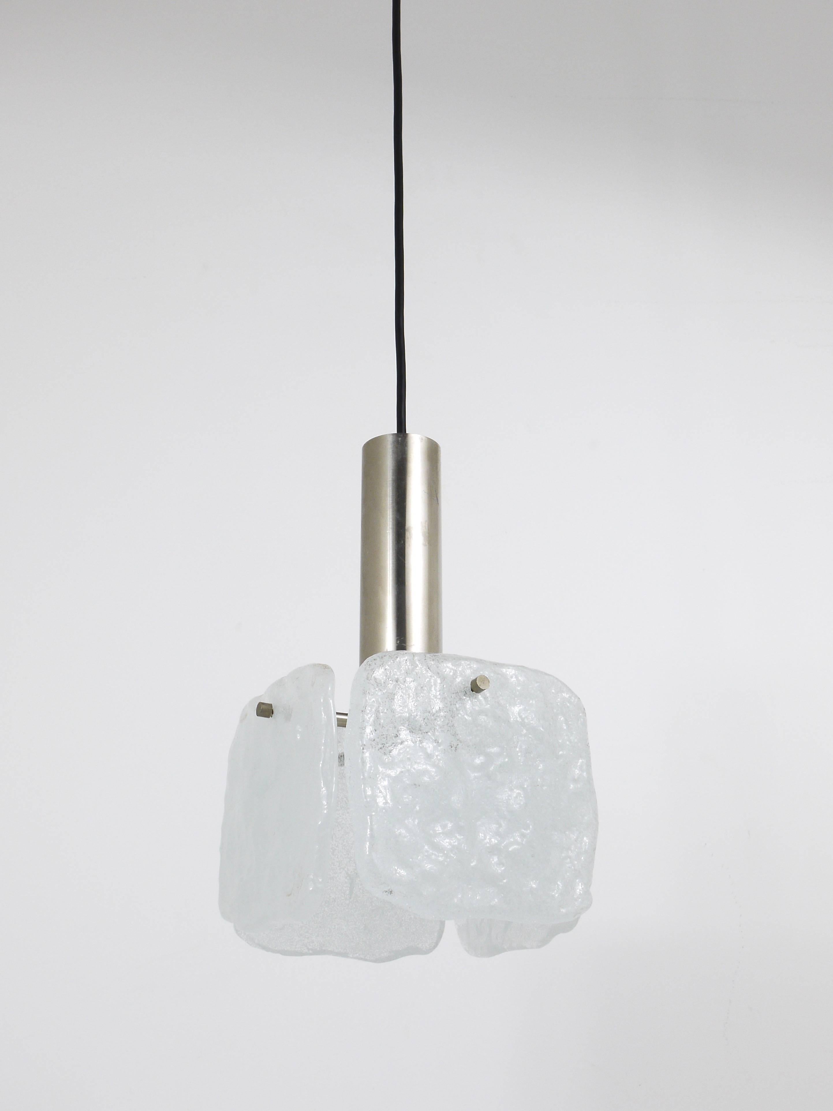 Up to two beautiful pendant lights, manufactured by Kalmar Austria in the 1960s. Sold and priced per piece. Stainless steel hardware with one light source and four square frosted ice glass panels on it. In very good condition. 

Each lamp measures