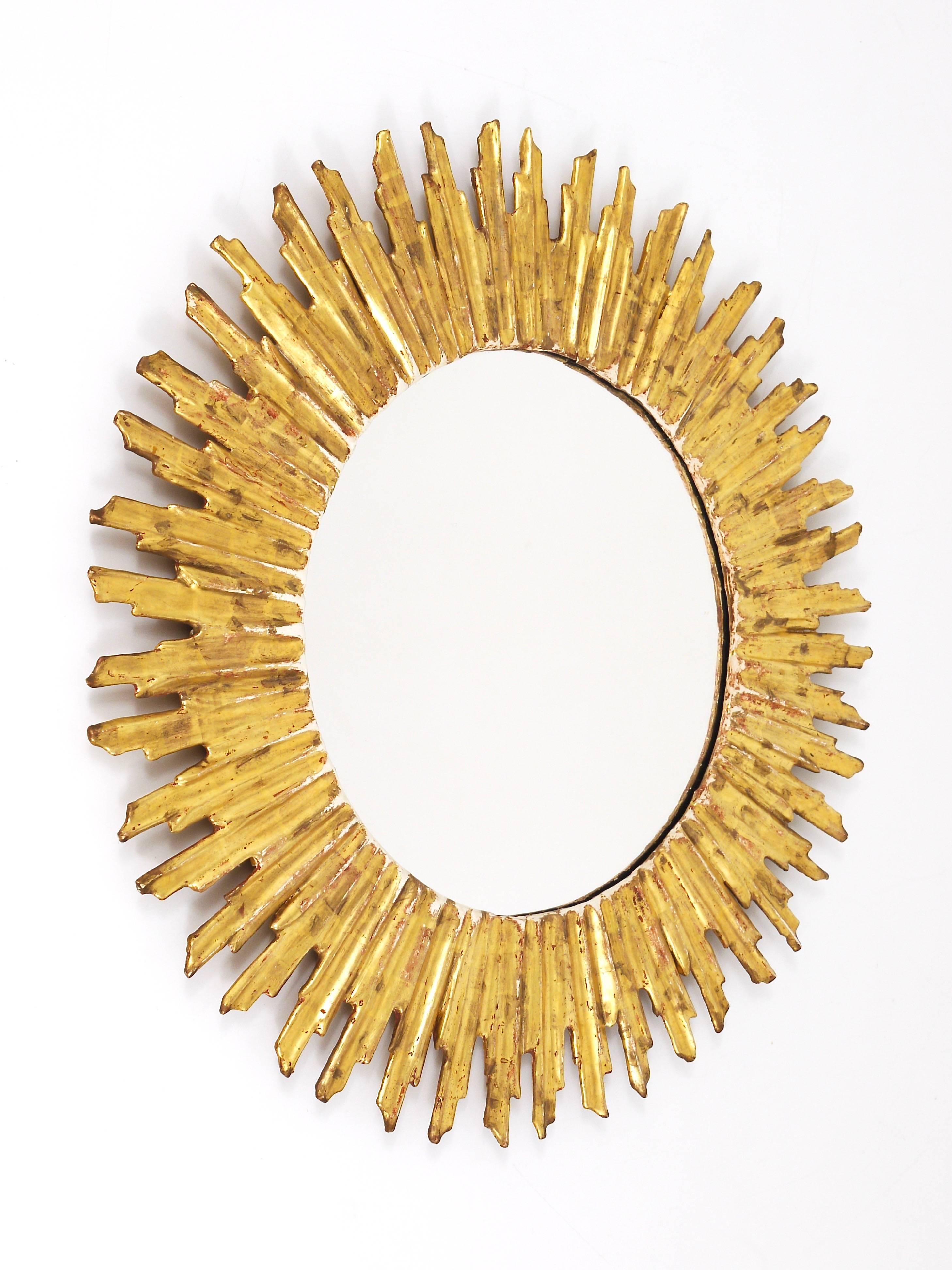 French Beautiful Carved Giltwood Sunburst Mirror, France, 1950s