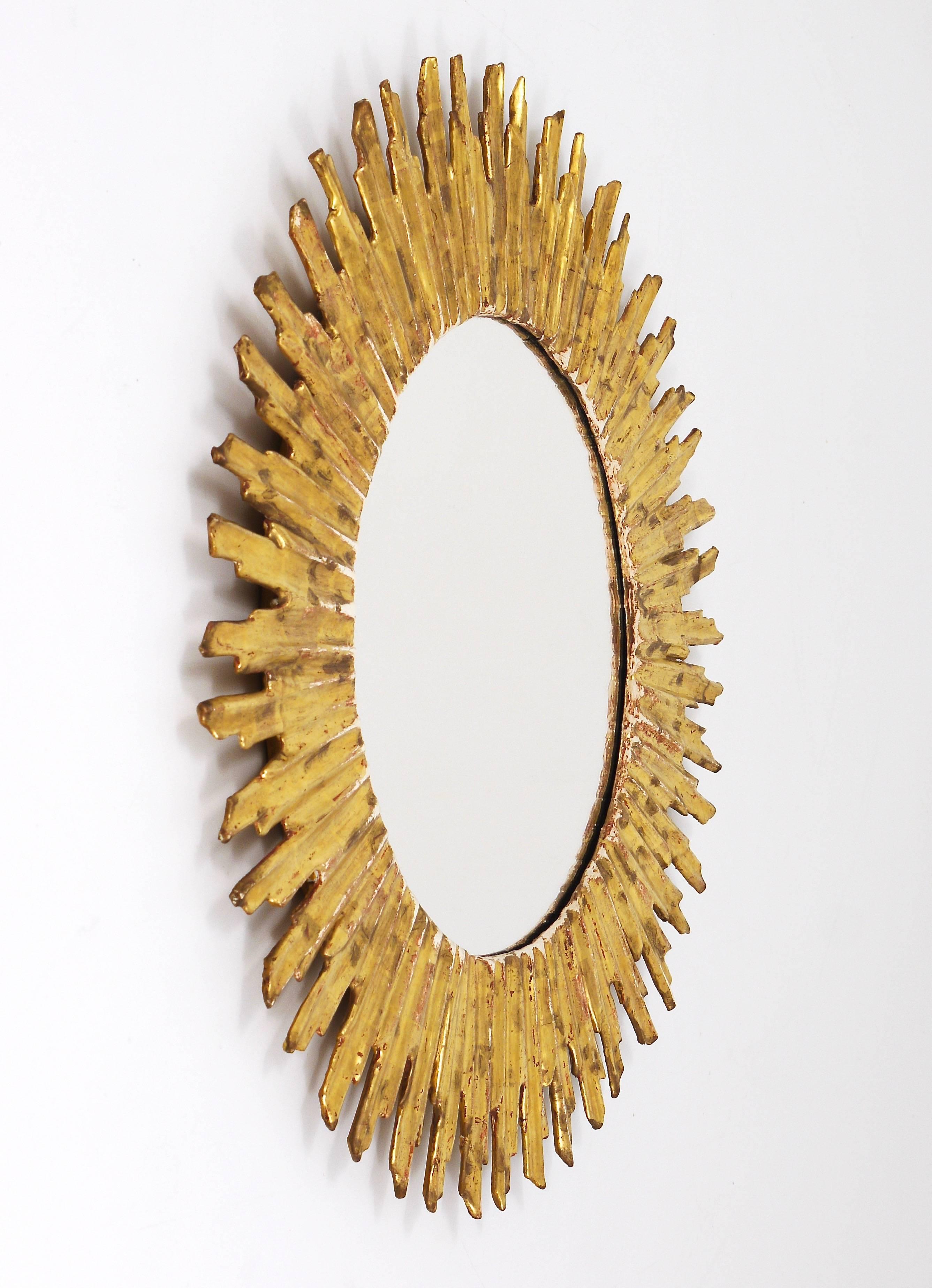Beautiful Carved Giltwood Sunburst Mirror, France, 1950s In Excellent Condition In Vienna, AT