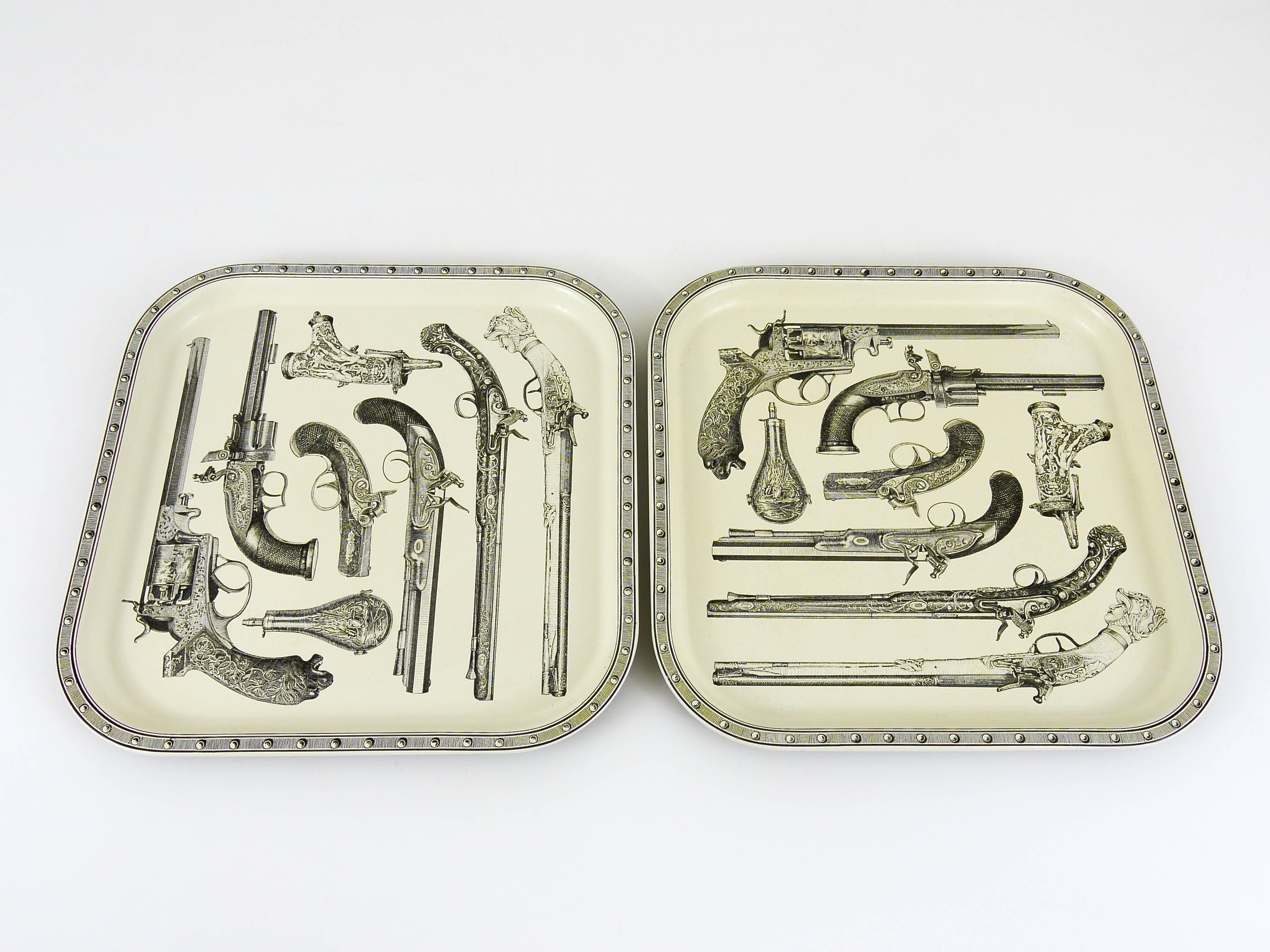 One beautiful and decorative square serving tray, made of metal, with a nice pistols and guns pattern. From the 1960s, unmarked, in the manner of Studio Piero Fornasetti, Italy. In very good condition with marginal signs of wear on the underneath.