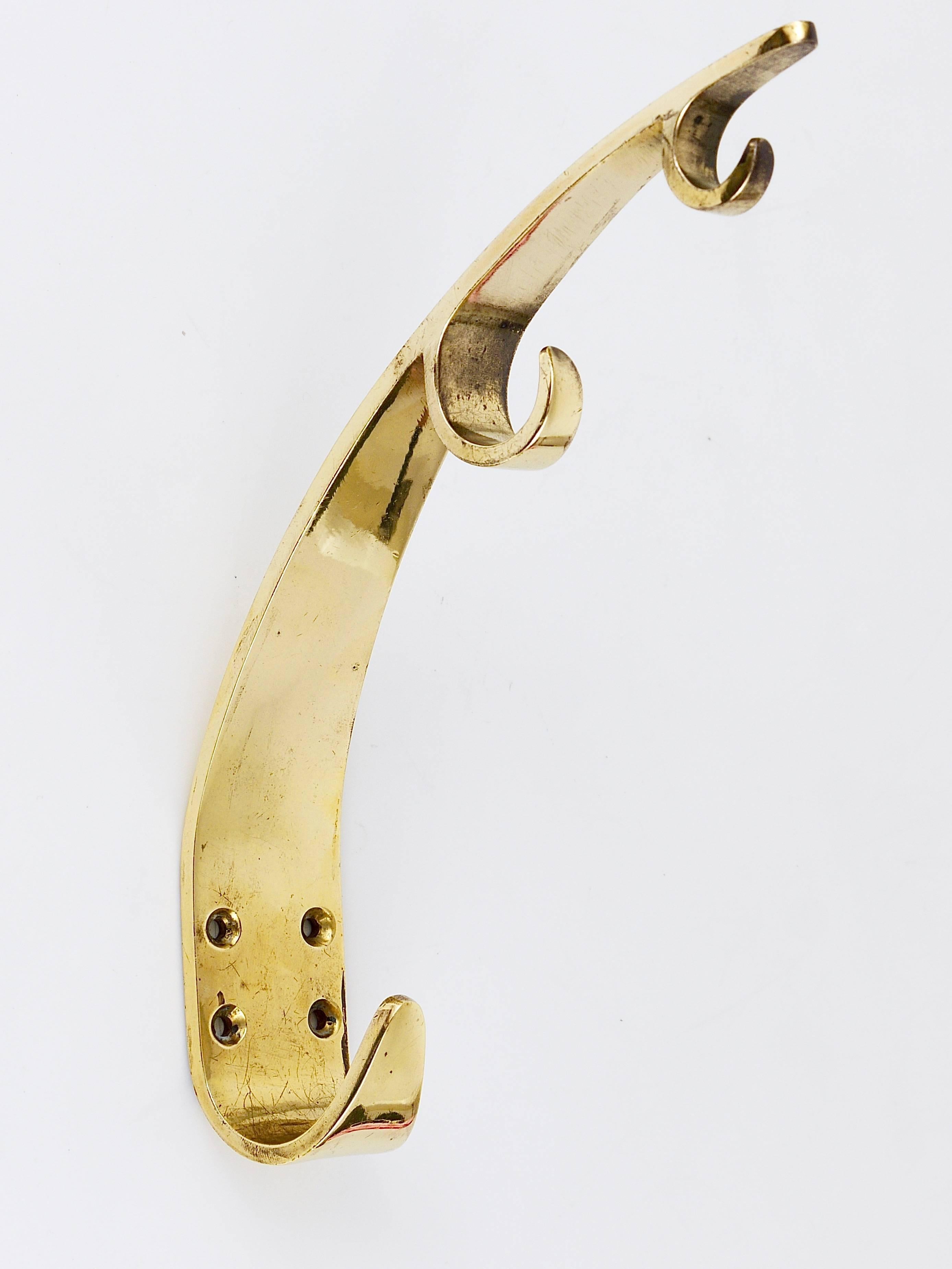 A pair of large and unusual modernist brass wall hooks, handcrafted in the 1950s by Hertha Baller, Austria. Gently polished by hand, in excellent condition with nice patina. The price is for the set of two. 