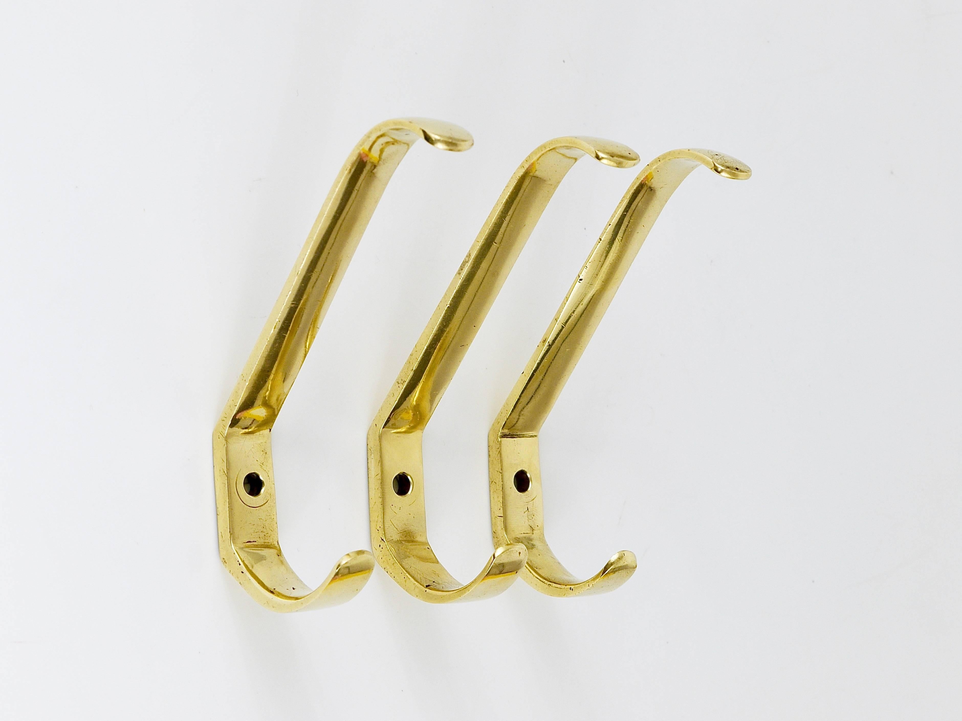 A set of three beautiful brass wall hooks, executed in the 1950s by Hertha Baller, Austria. Gently polished by hand, in very good condition with nice patina. The price is for the set of three hooks.