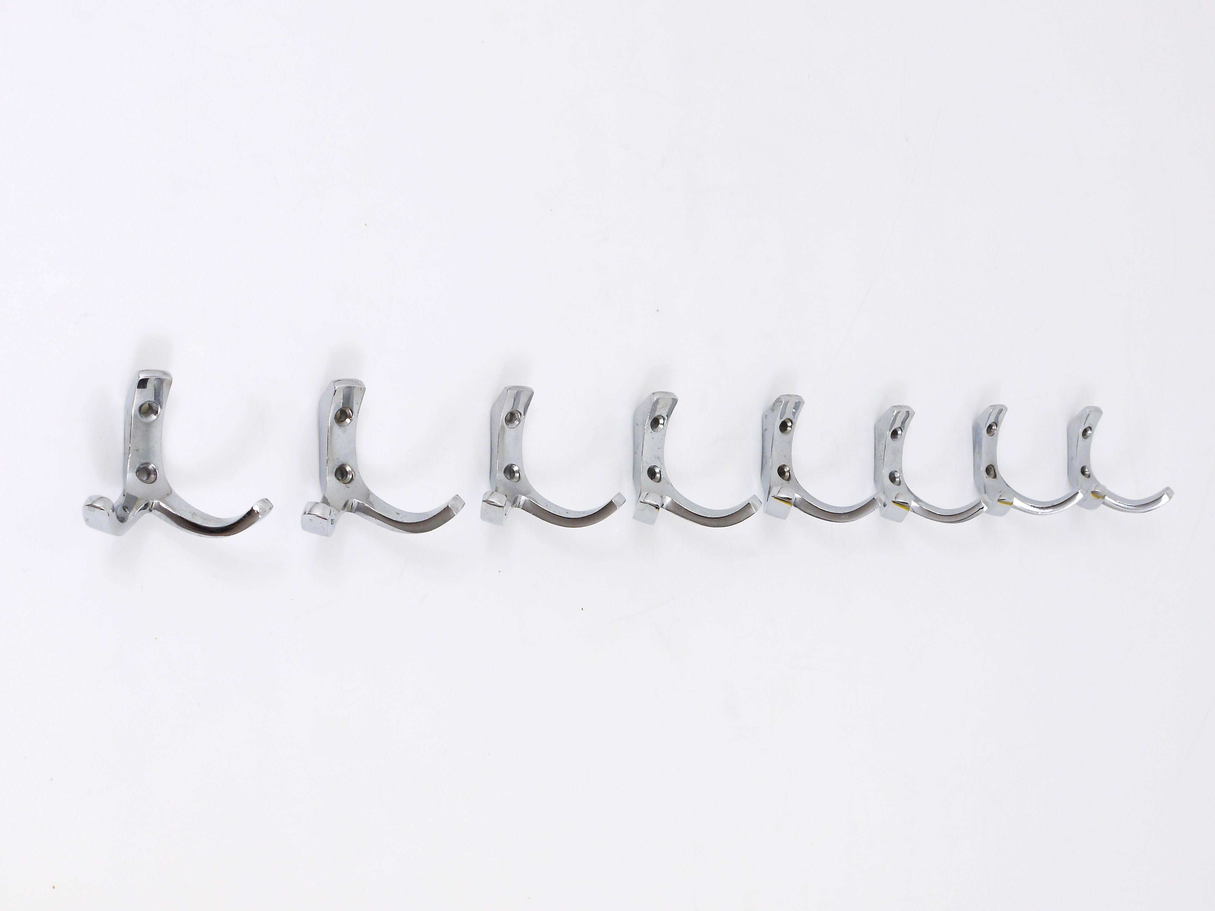 Up to four Austrian Mid-Century coat hooks, executed in the 1950s by Hertha Baller, Austria. Made of chrome-plated brass in very good condition with nice patina. Four hooks available, can be sold separately, the price is per piece. 

We offer many