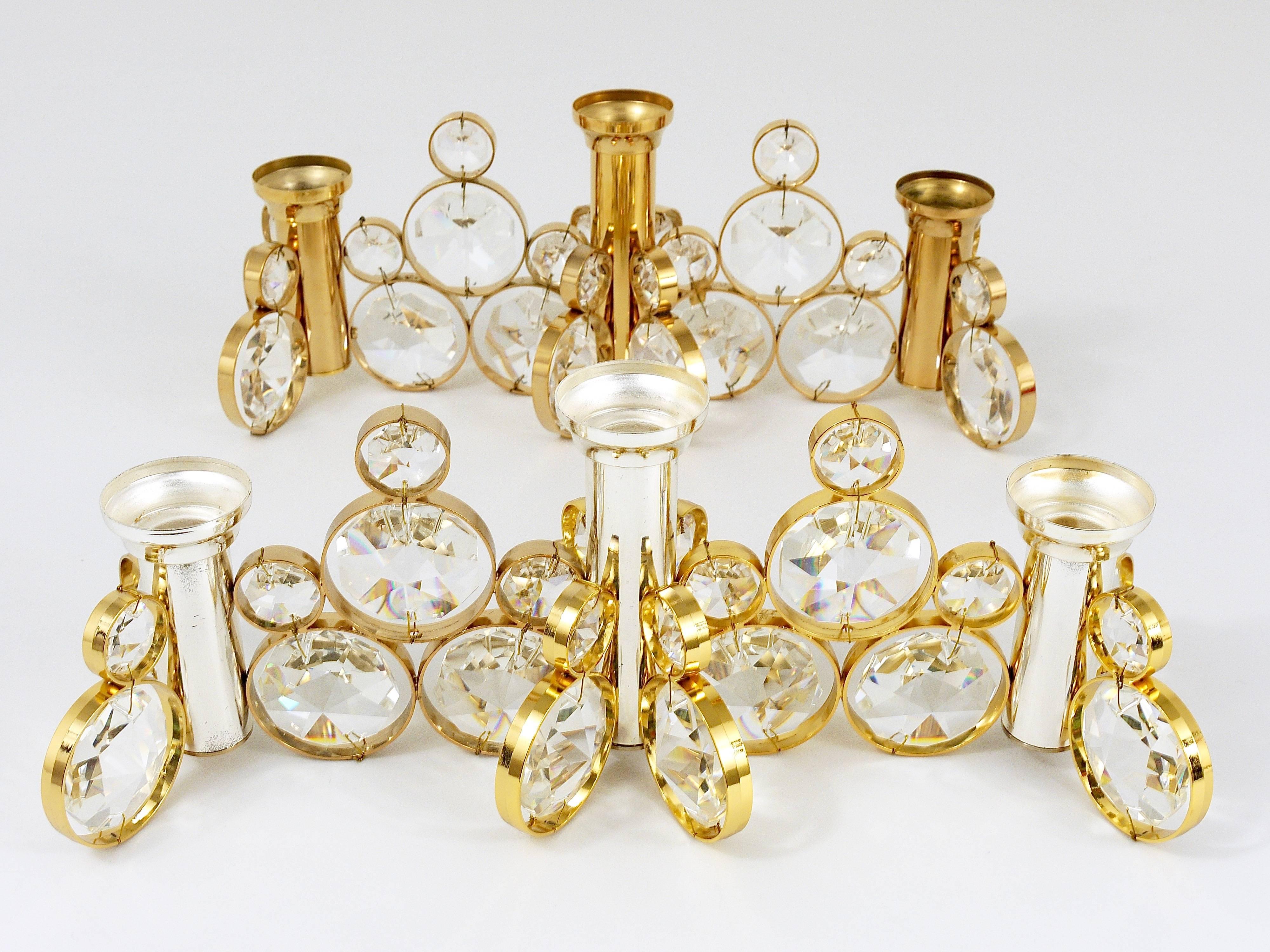 Up to ten beautiful candle holders in the style of Gaetano Sciolari. Manufactured in the 1970s by Palwa Germany. Made of gold-plated brass with huge faceted crystals. In excellent condition, new old stock. There are ten identical candle holders