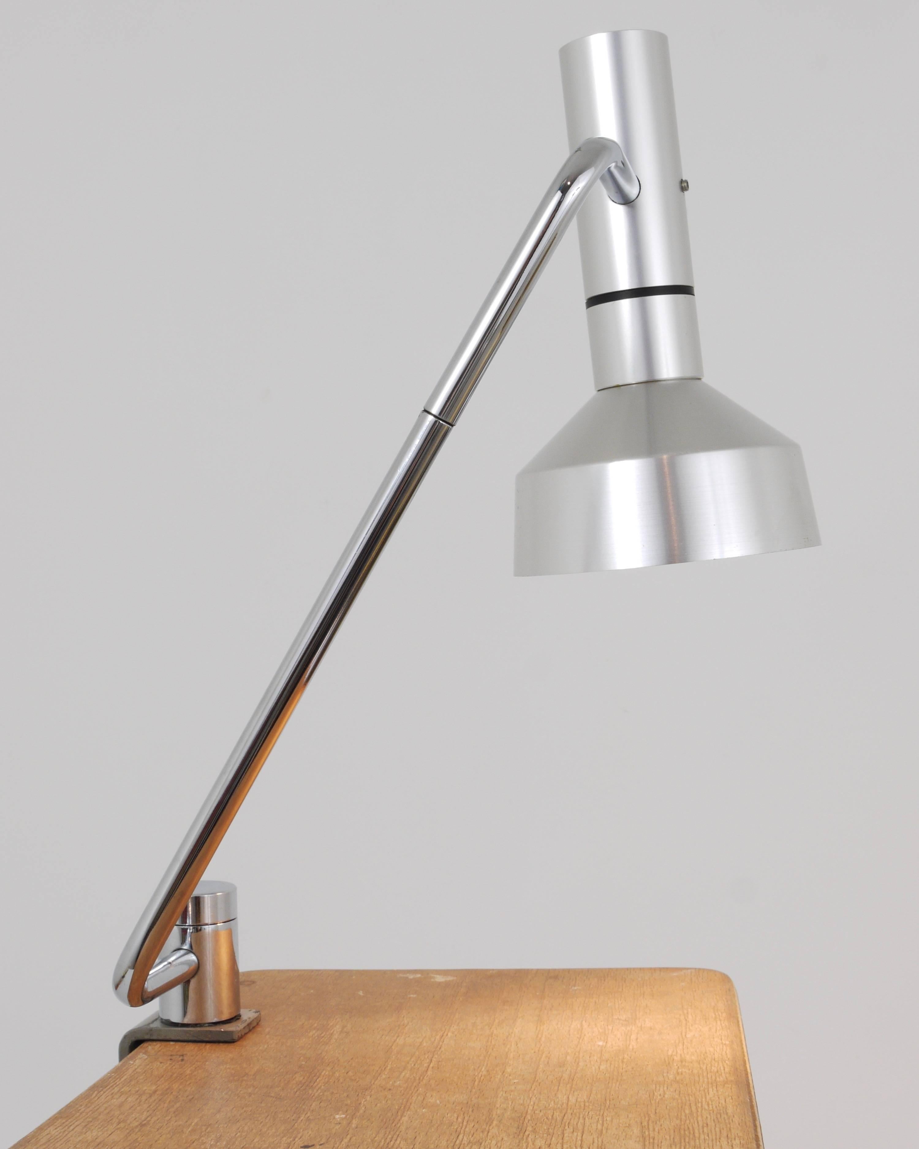 A beautiful table clamp lamp, designed by Rico & Rosemarie Baltensweiler, manufactured by Baltensweiler AG, Ebikon, Switzerland, in the 1960s. It has a chrome-plated neck with a brushed aluminium lampshade and a big white switch on the lampshades
