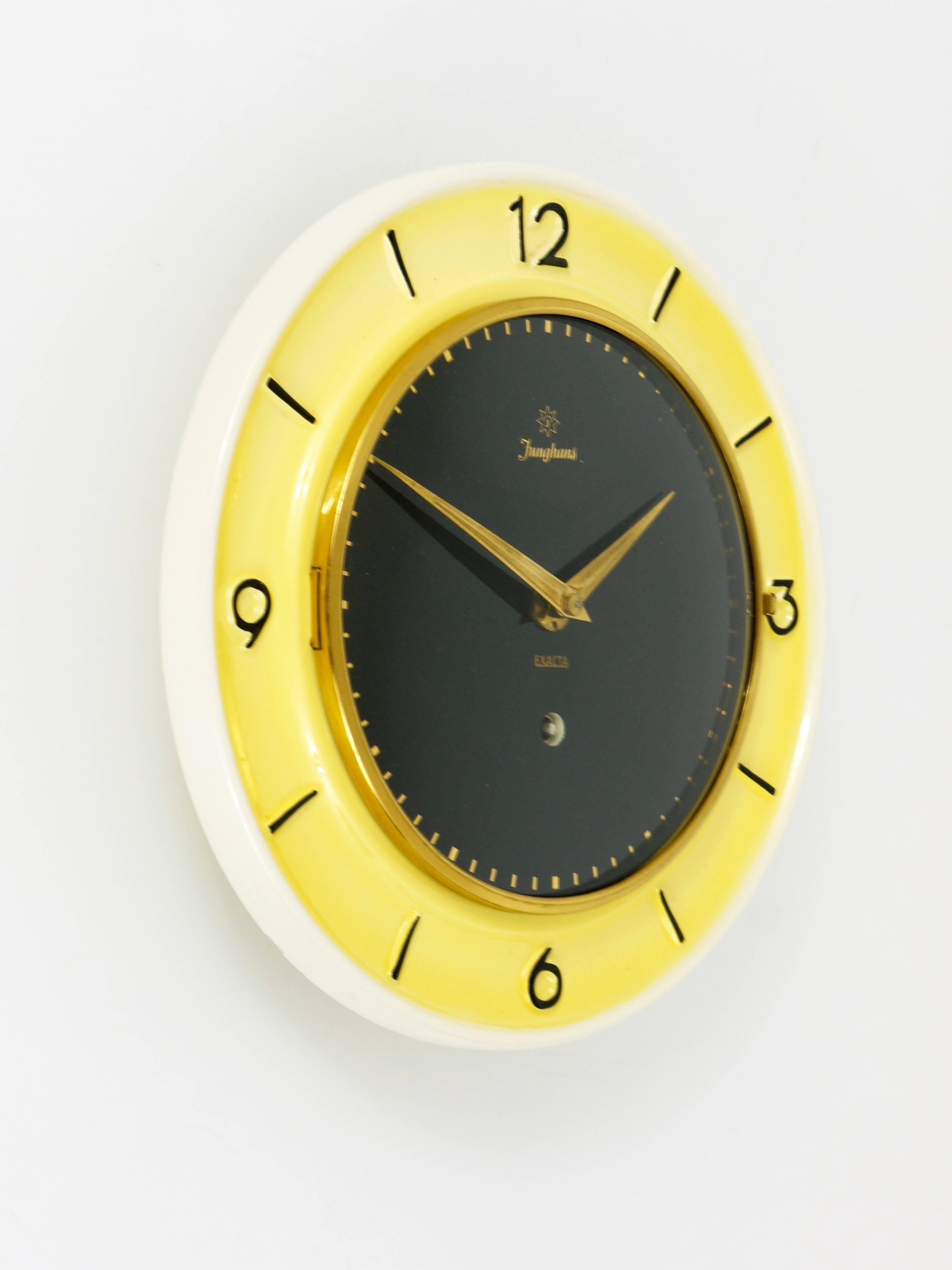 Mid-Century Modern Pastel Yellow Junghans Mid-Century Brass Wall Clock, Germany, 1950s