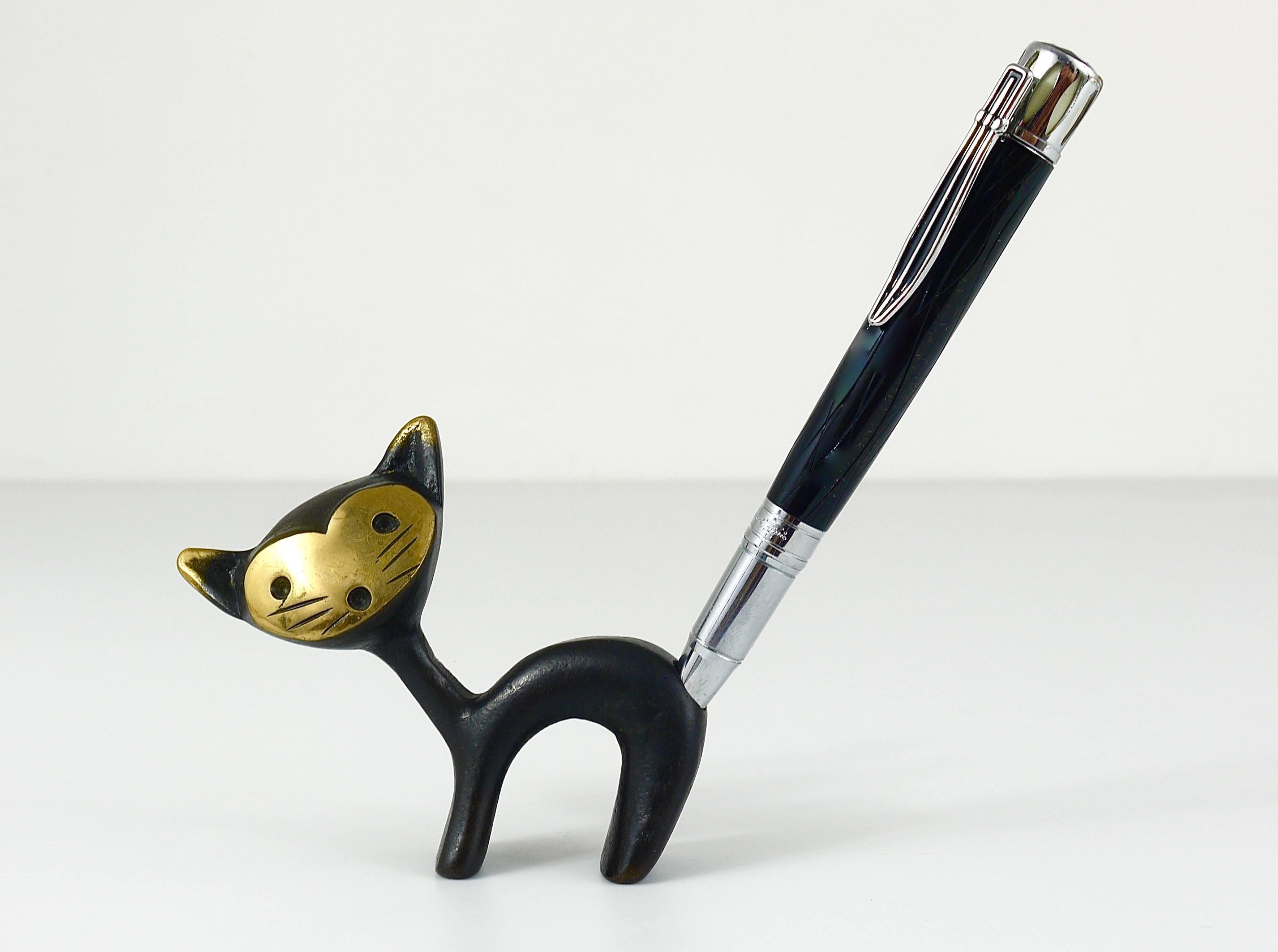 A very charming Austrian, Mid-Century pen or pencil holder, displaying a cat. A very humorous design by Walter Bosse executed by Hertha Baller Austria in the 1950s. Made of brass in excellent condition.
