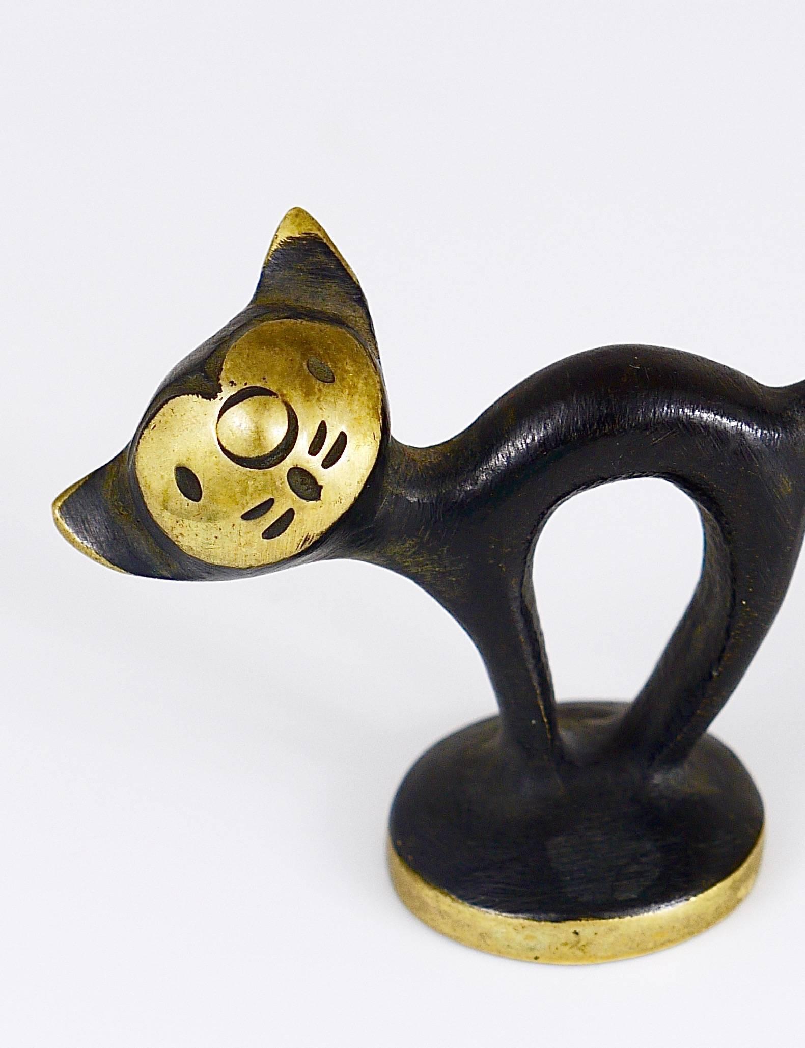 A very charming cat sculpture from the 1950s, made of brass. A very humorous design by Walter Bosse, executed by Hertha Baller Austria in the 1950s. In excellent condition. Marked.