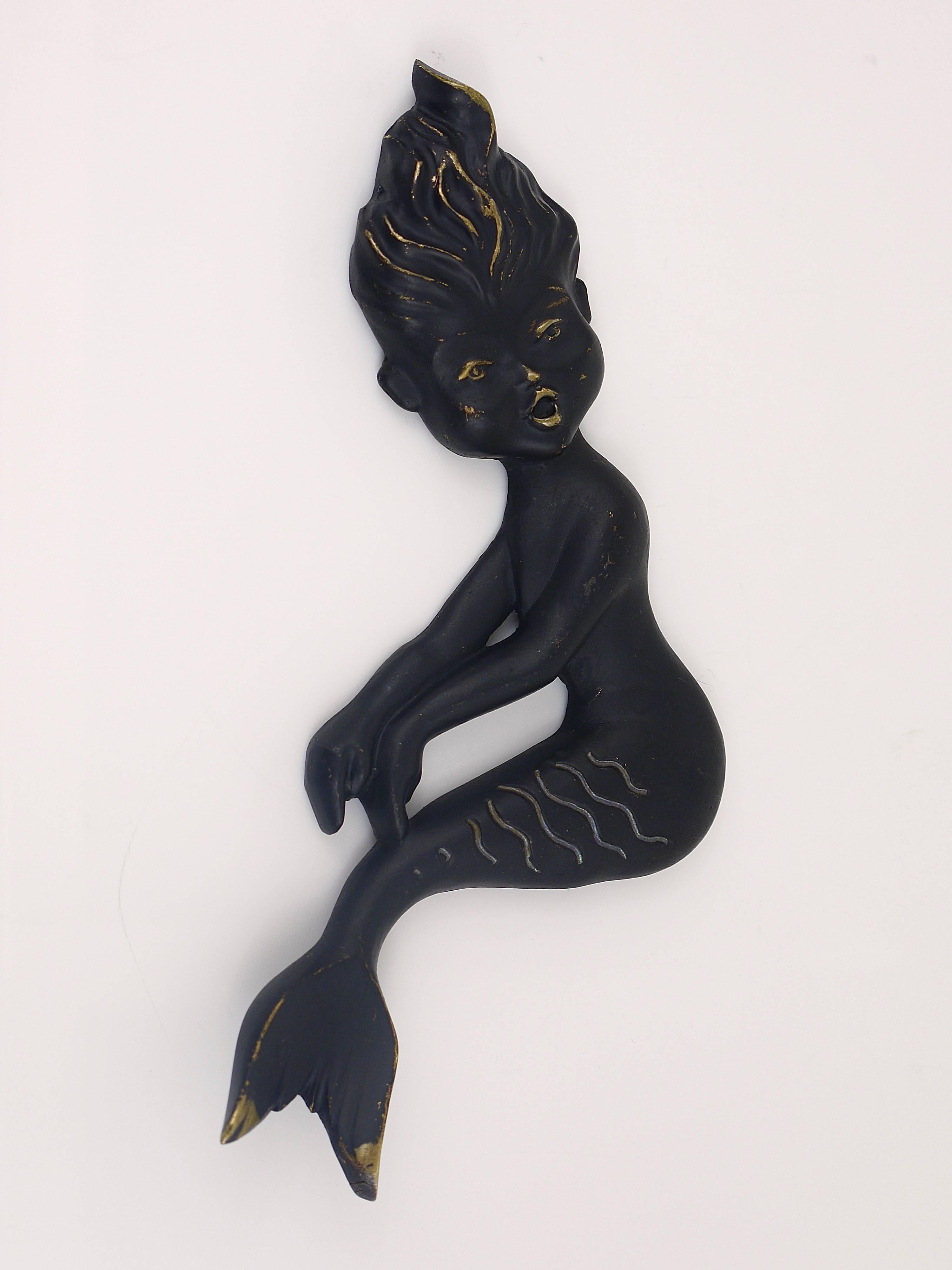 A lovely Mid-Century mermaid sculpture, made of black-finished brass. Designed by Walter Bosse, manufactured in the 1950s by Hertha Baller, Austria. In very good condition. A very decorative piece. 
We offer more Walter Bosse brass objects in our