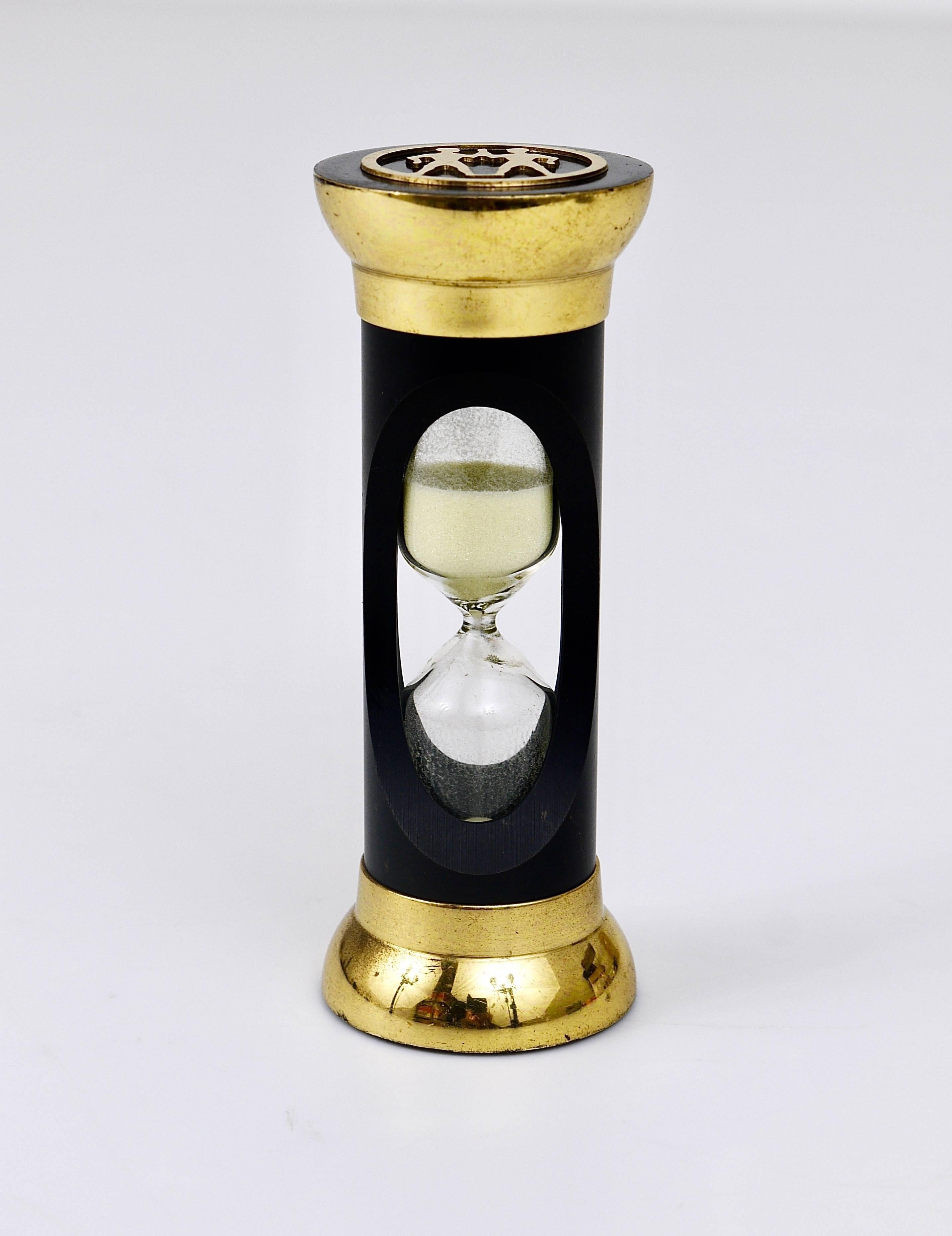 A beautiful modernist hour glass / sand timer, made of brass, displaying the zodiac sign twins, Austria, 1950s, designed by Walter Bosse, executed by Hertha Baller. In very good condition, marginal wear. We offer more Walter Bosse objects in our