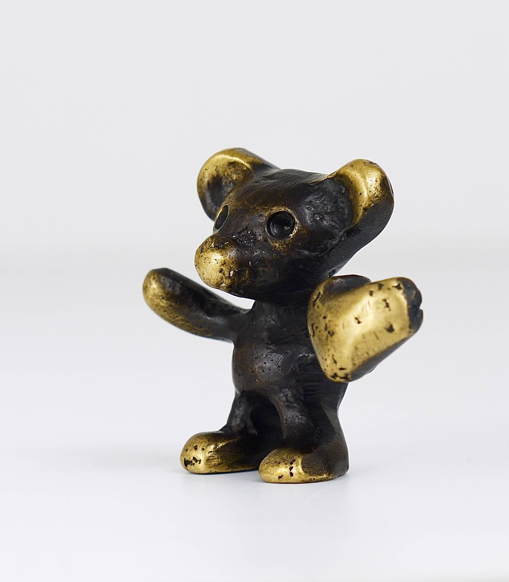 A lovely brass figurine, displaying a little bear with a heart in his hand. Designed by Walter Bosse, executed in the 1950s by Hertha Baller, Austria. In very good condition. We offer other Walter Bosse brass objects in our other listings.