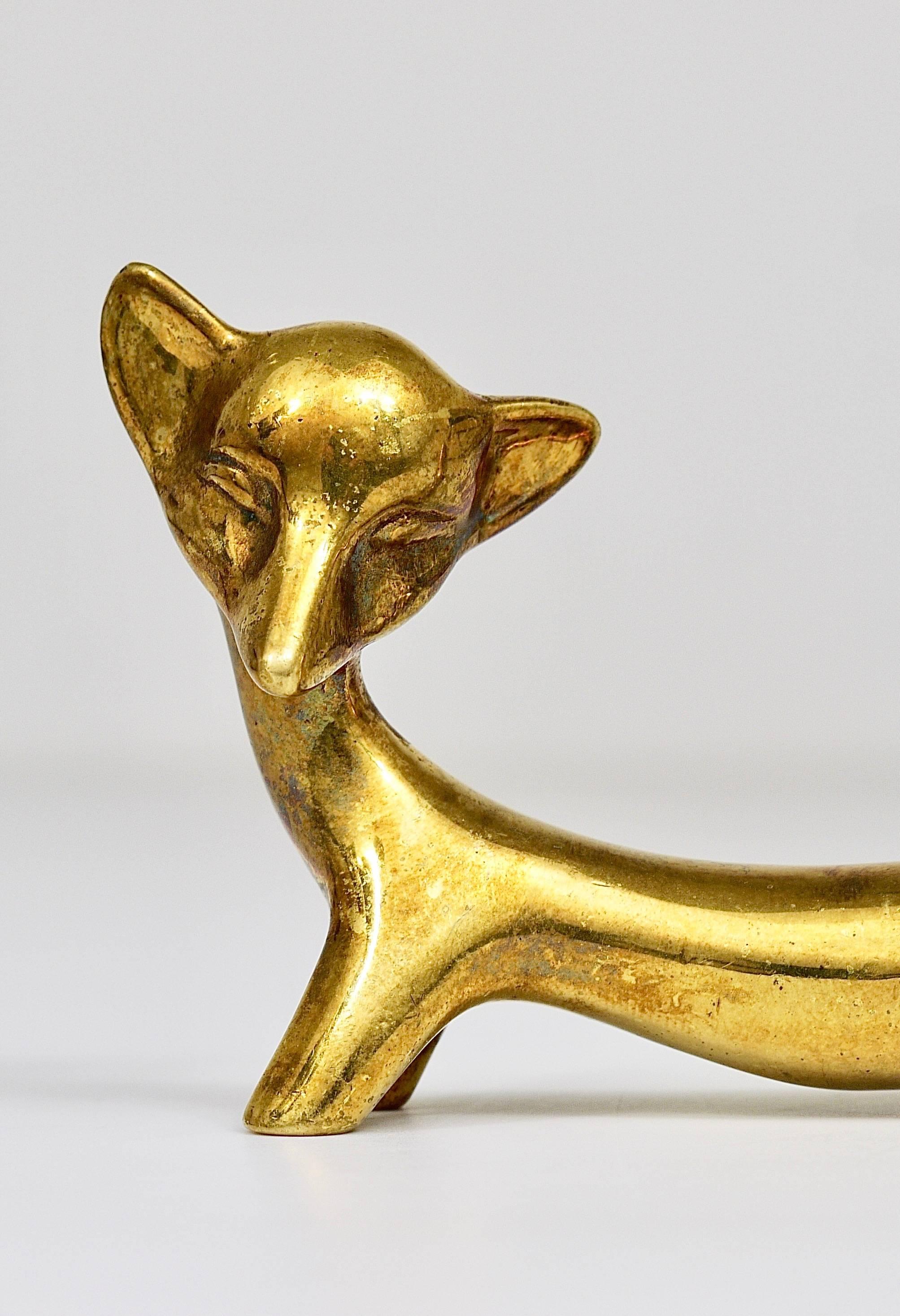 A lovely fox sculpture made of brass from the 1950s. Designed by Walter Bosse, executed by Hertha Baller, Austria. In good condition with charming patina. We offer more Walter Bosse brass objects in our other listings.
