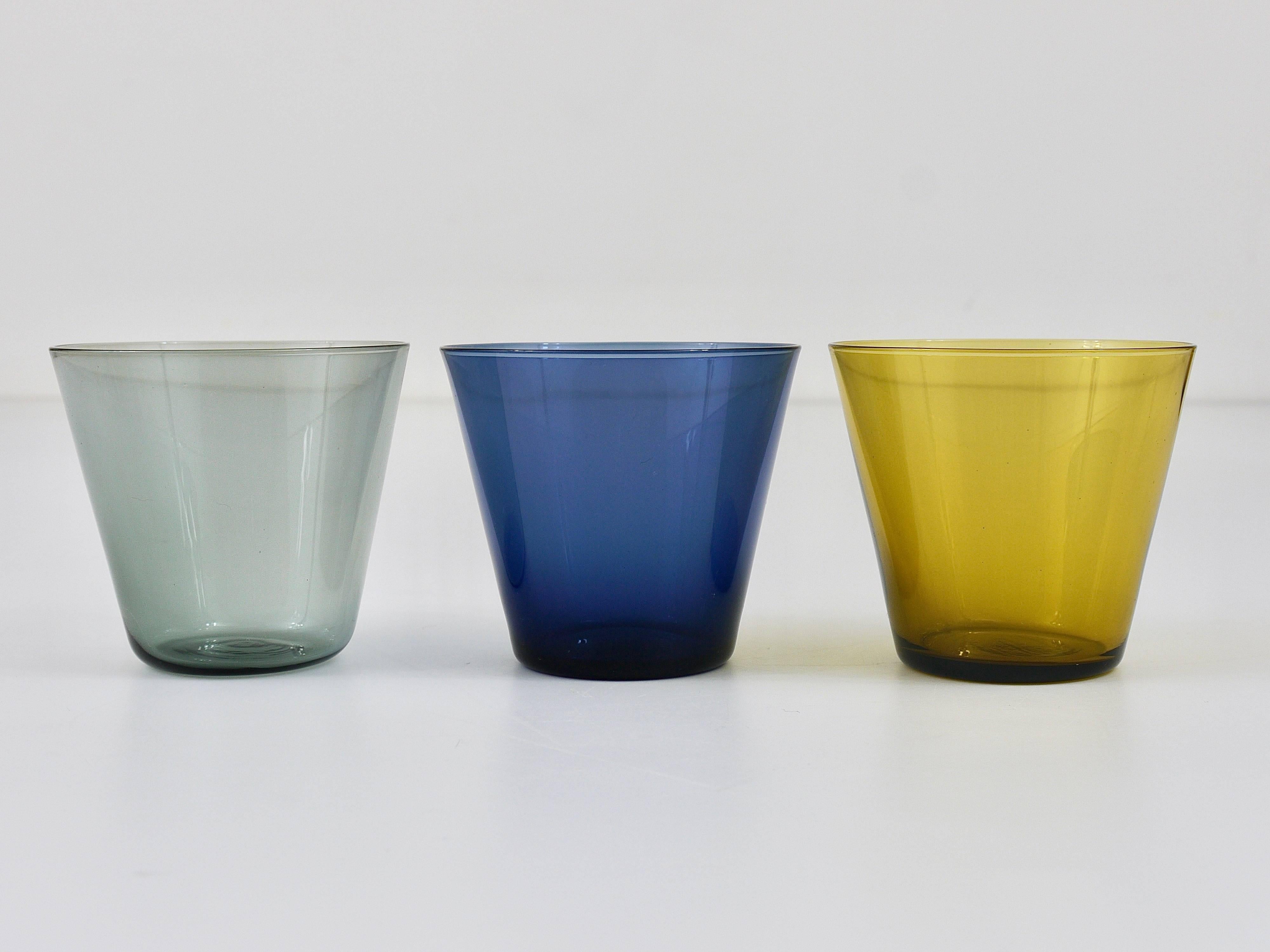 A set of six beautiful Kartio drinking glasses in grey, blue and amber from the 1950s. Designed by Kaj Franck, executed by Nuutajarvi Nottsjo Finland. In excellent condition.