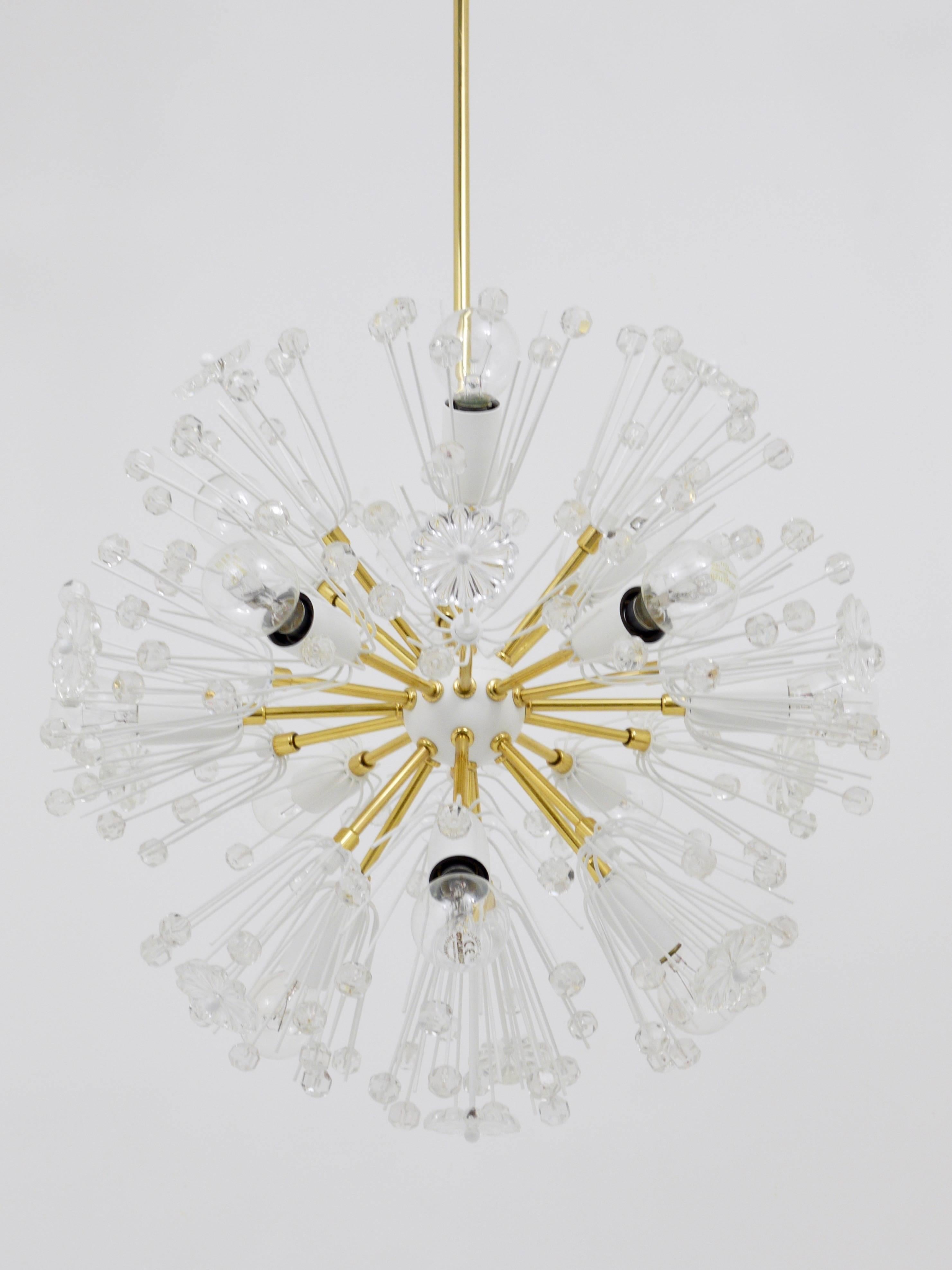 A stunning Mid-Century sputnik dandelion blowball chandelier, designed by Emil Stejnar and produced by Rupert Nikoll Vienna / Austria in the 1950s. This early model features a central white ball and a tulip-shaped canopy. It is crafted from brass