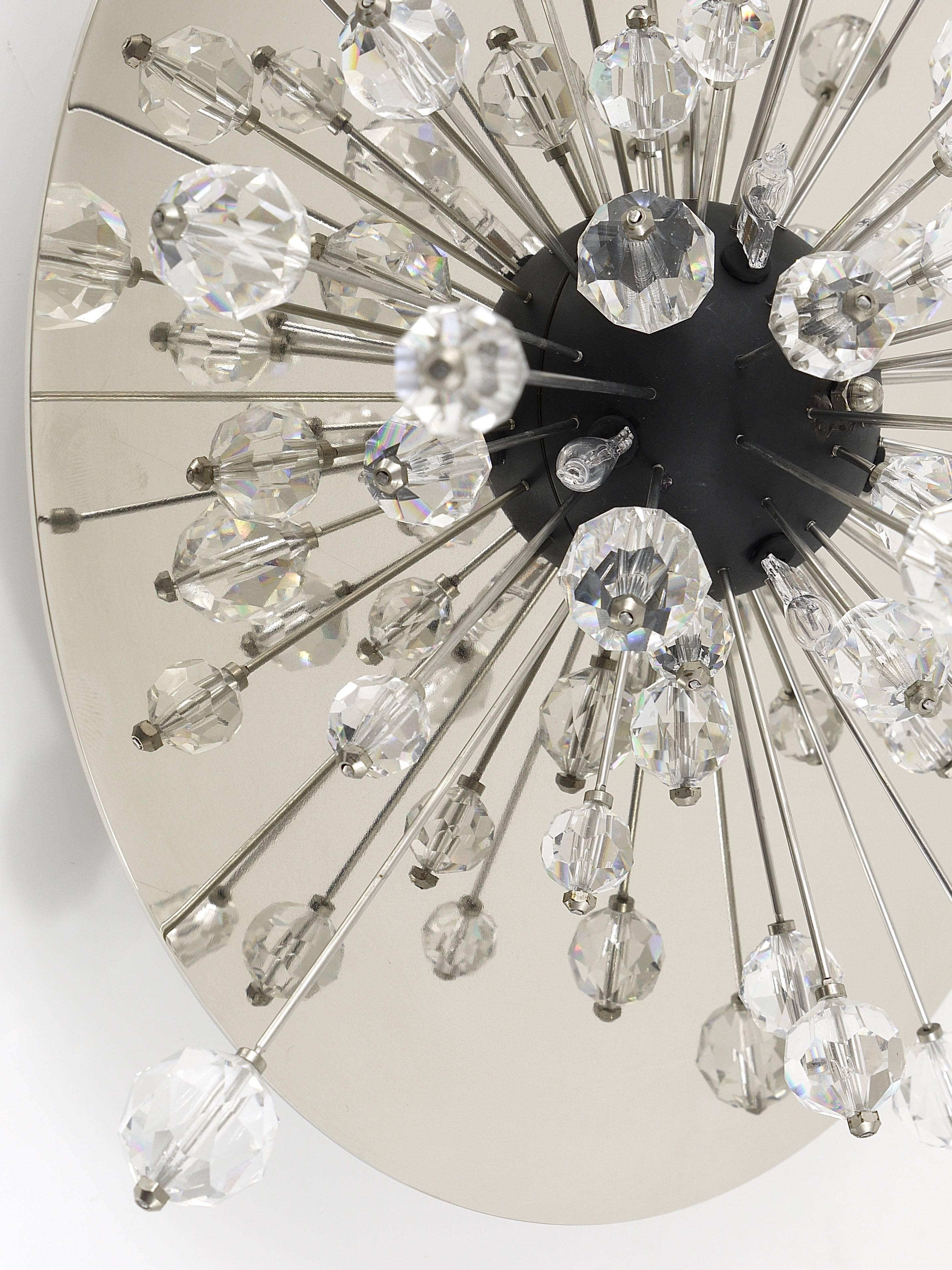 Up to two custom-made Mid-Century met Sputnik lights, designed and executed by J. & L. Lobmeyr, Austria. To be used as wall lights or ceiling lights. Each light has a round nickel-plated, mirror-finished backplate and rays covered with Swarovski