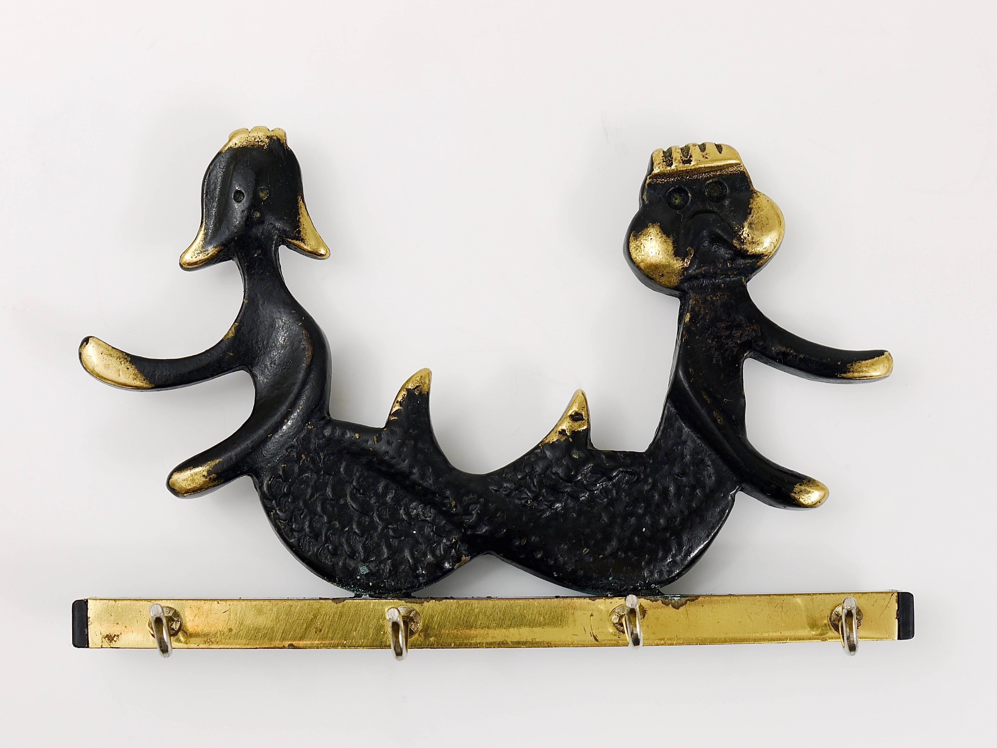 A charming and rare key holder, displaying a sea god and a mermaid. A humorous design by Walter Bosse, executed by Hertha Baller Austria in the 1950s. Made of brass, in good condition with nice patina. Also suitable as a towel holder or for dish