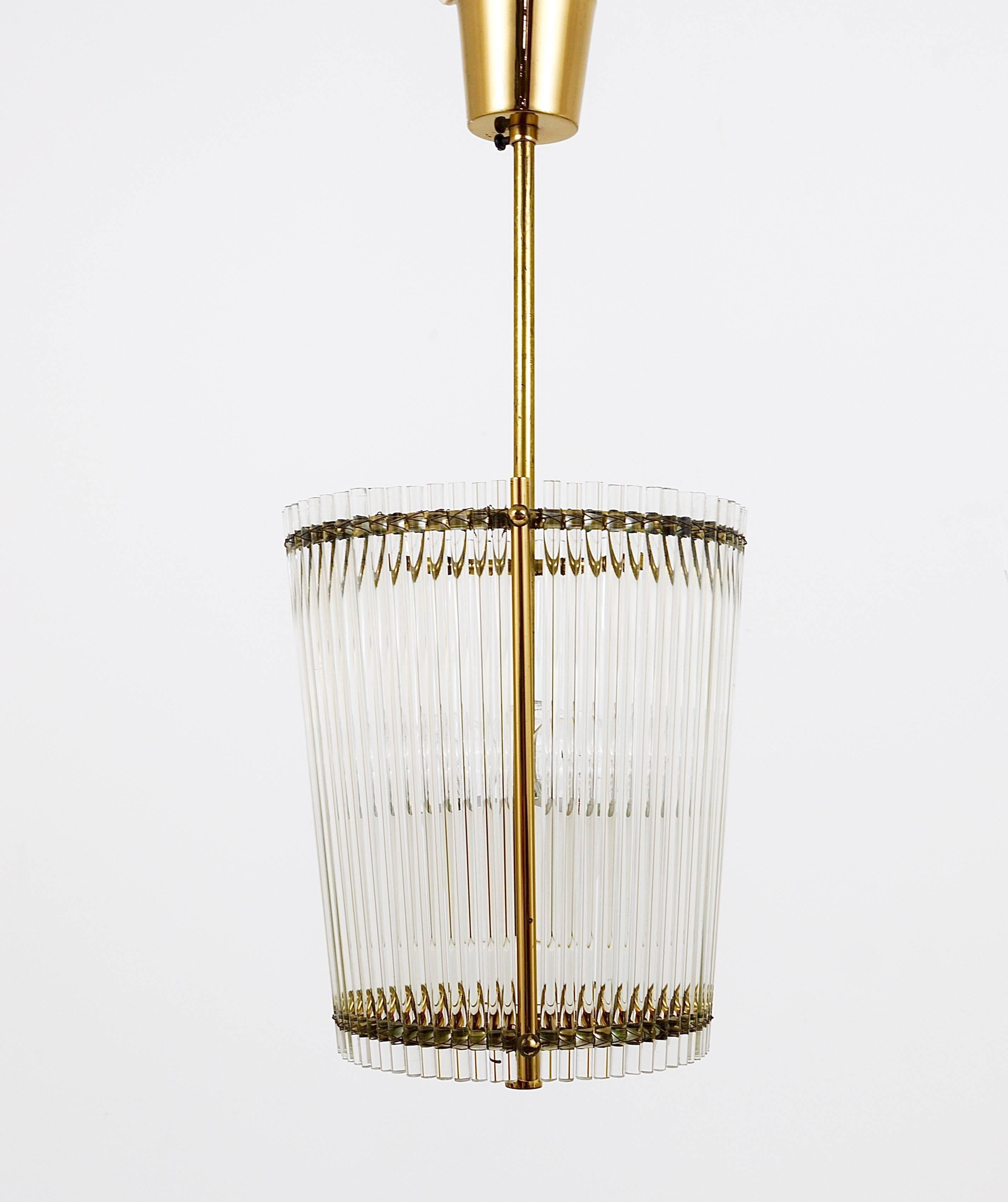 A charming modernist brass drum chandelier with glass rods. Made in Italy in the 1950s. Three light sources. In good condition with charming patina on the brass.

diameter 8