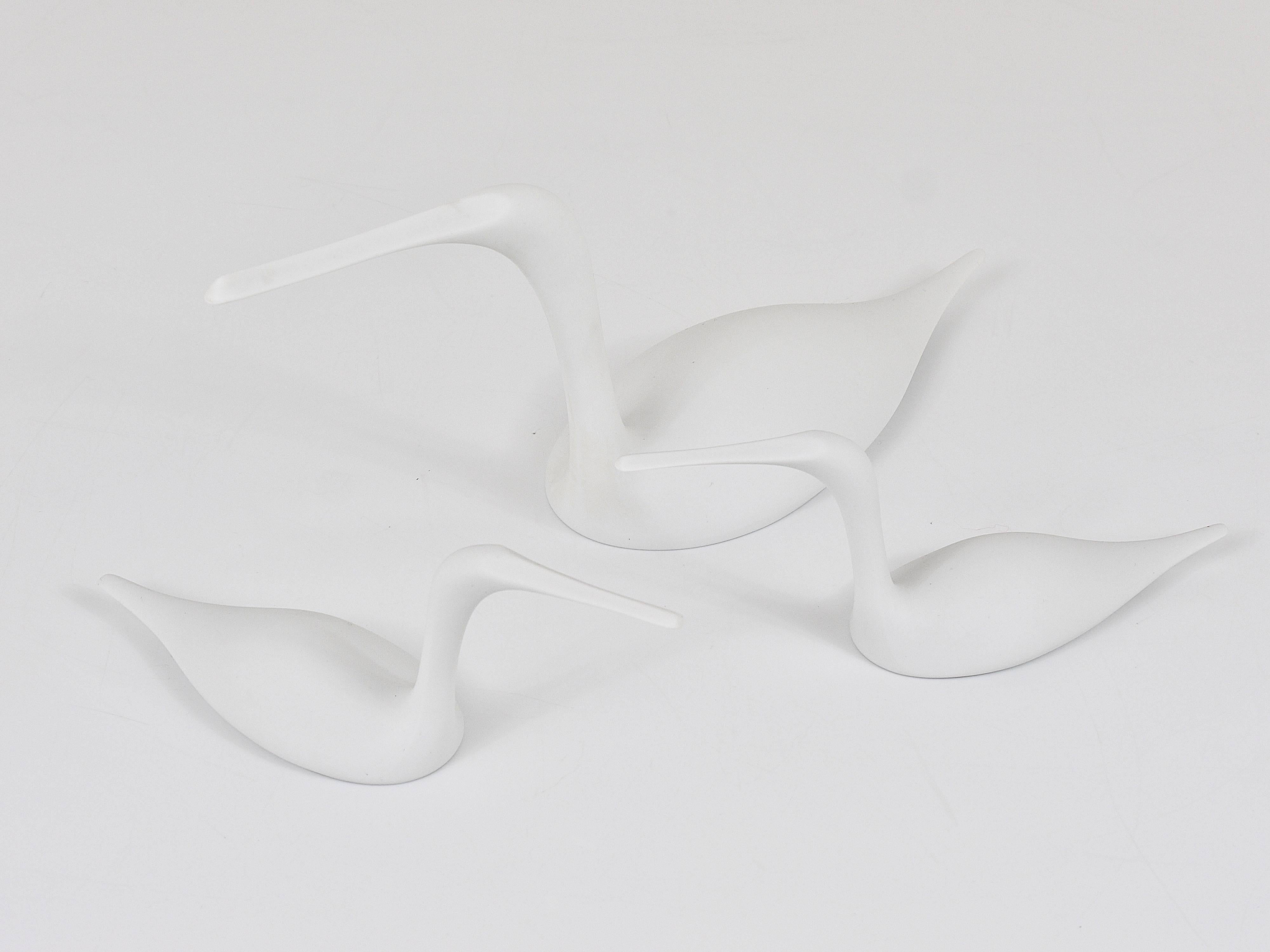 A decorative set of three swimming common lone birds from the 1970s. Designed by Tapio Wirkkala for Rosenthal Studio-line, Germany. Beautiful pieces, made of white, matte porcelain. In excellent condition. 

The bigger bird measures: 15