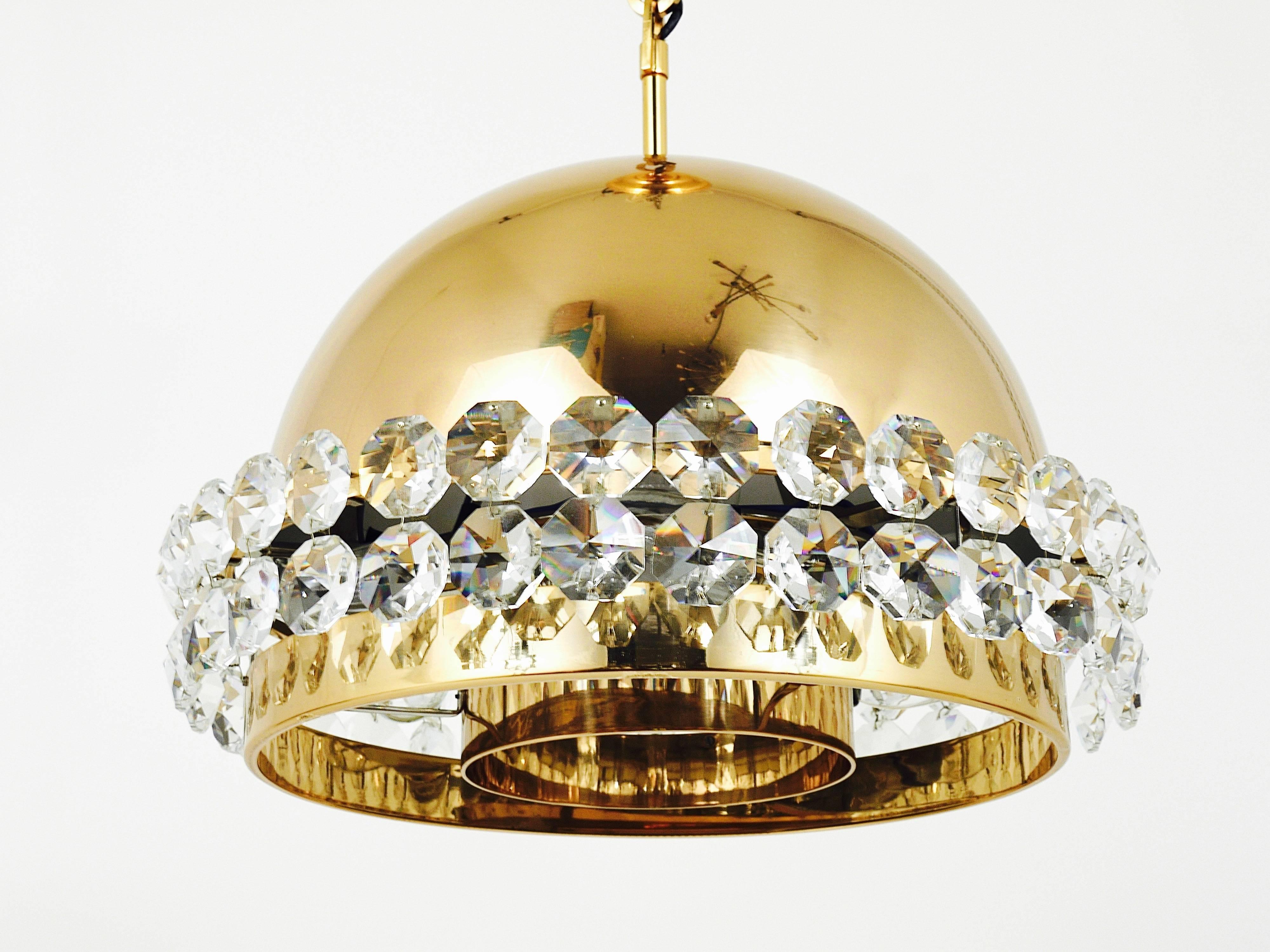 A beautiful Mid-Century gilt brass globe chandelier with big, octagonal diamond-shaped faceted crystals. Executed in the 1970s by Bakalowits & Sohne, Austria. The chandelier has seven light sources. In very good condition. A handmade and exclusive