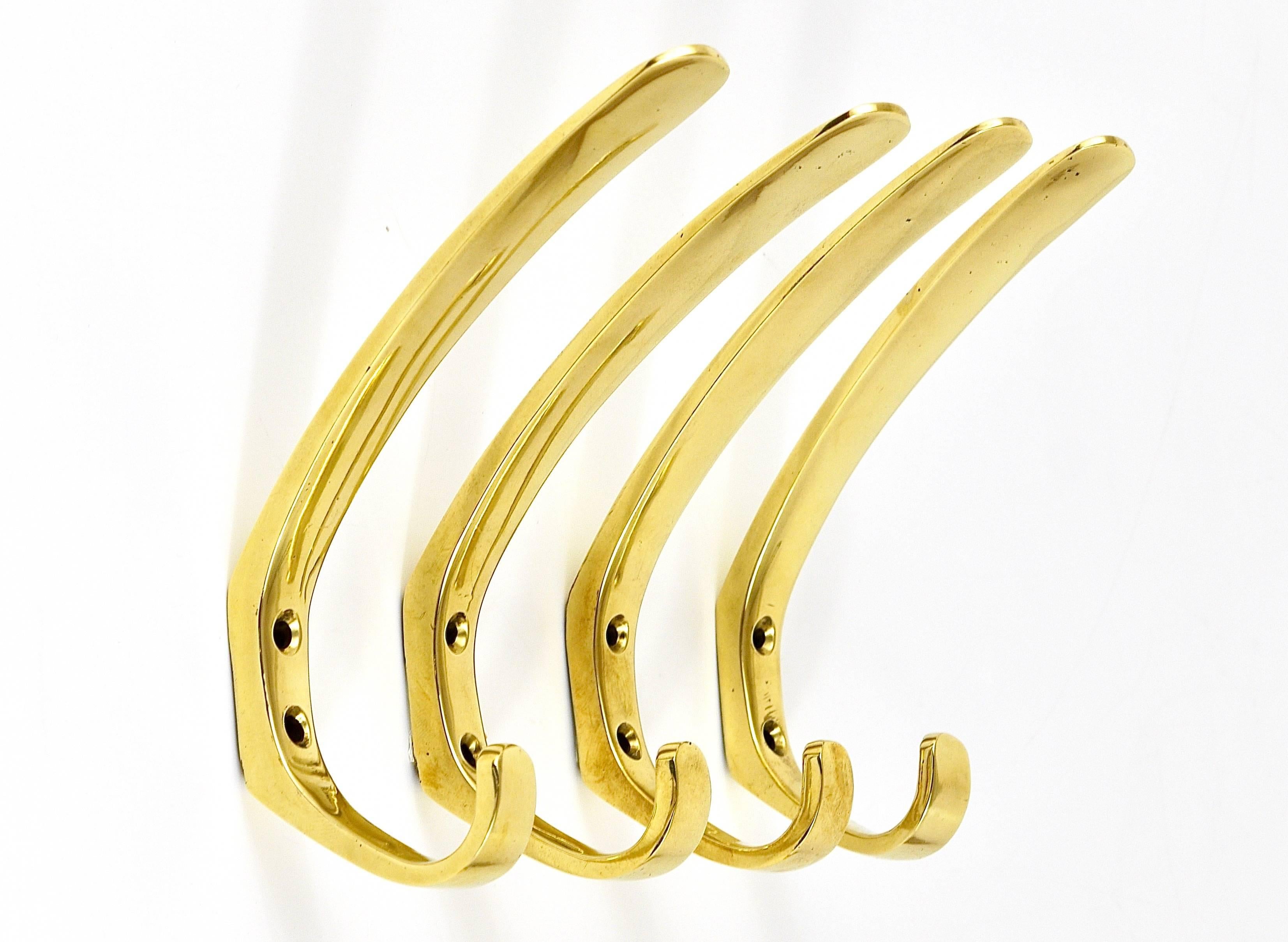 Up to three beautiful modernist brass wall hooks, executed in the 1950s by Hertha Baller, Austria. Solid brass, gently polished by hand, in very good condition with marginal patina. Five hooks are available, sold and priced per piece.