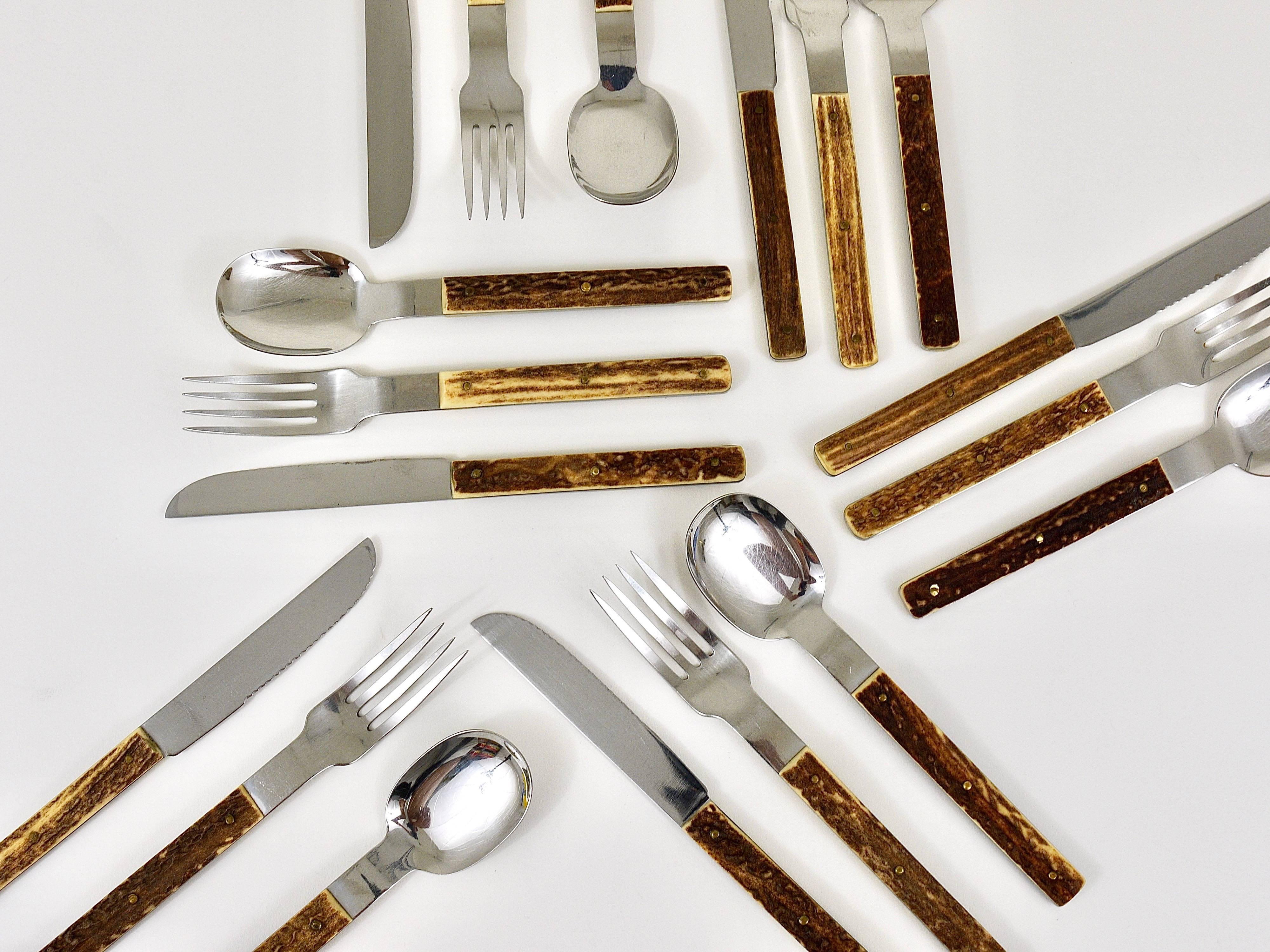 A set of modernist flatware for six persons. Consisting of 18 pieces, spoons, forks and knives. Executed in the 1960s by Amboss Austria. Made of stainless steel with beautiful deer antler handles. In very good condition with marginal signs of age,