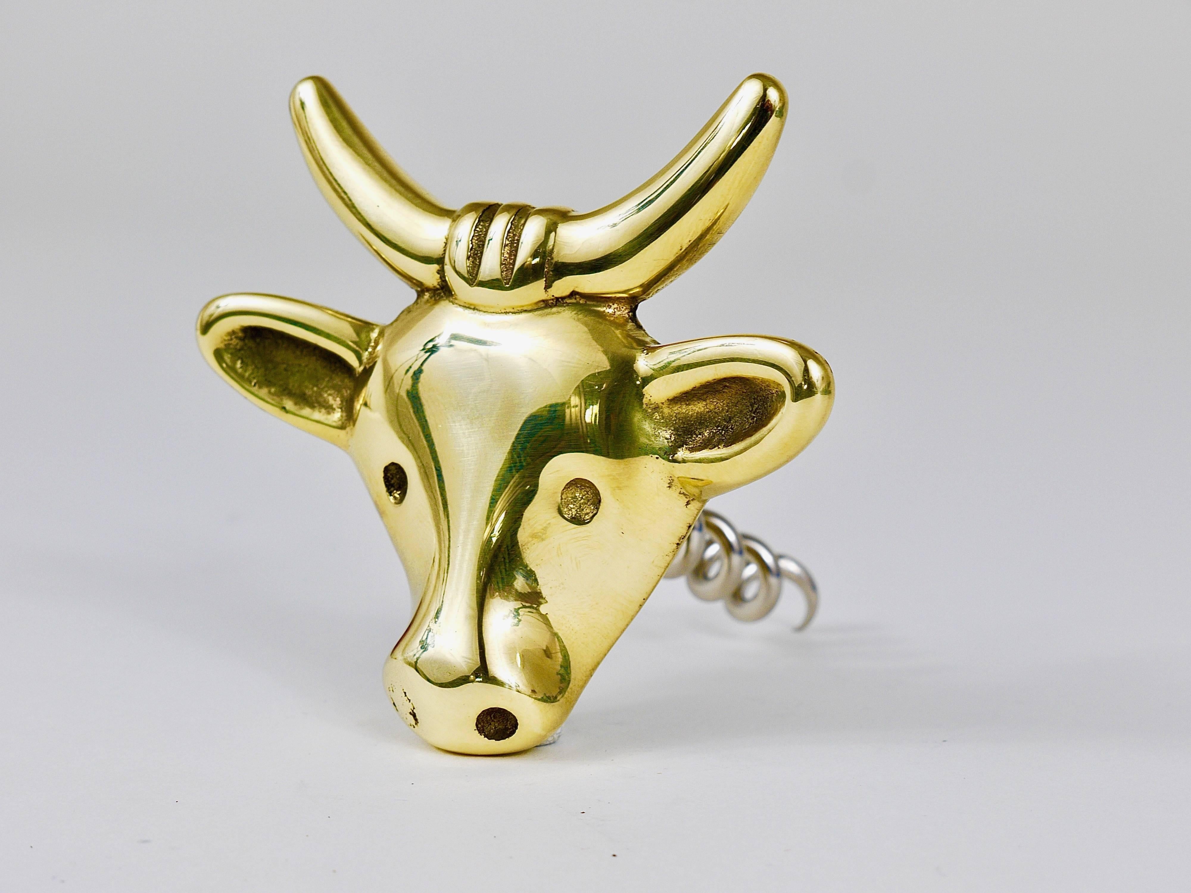 A charming Mid-Century bottle opener/cork screw, displaying a cow. A very humorous design by Walter Bosse, executed by Hertha Baller Austria in the 1950s. Made of polished brass, in very good condition.