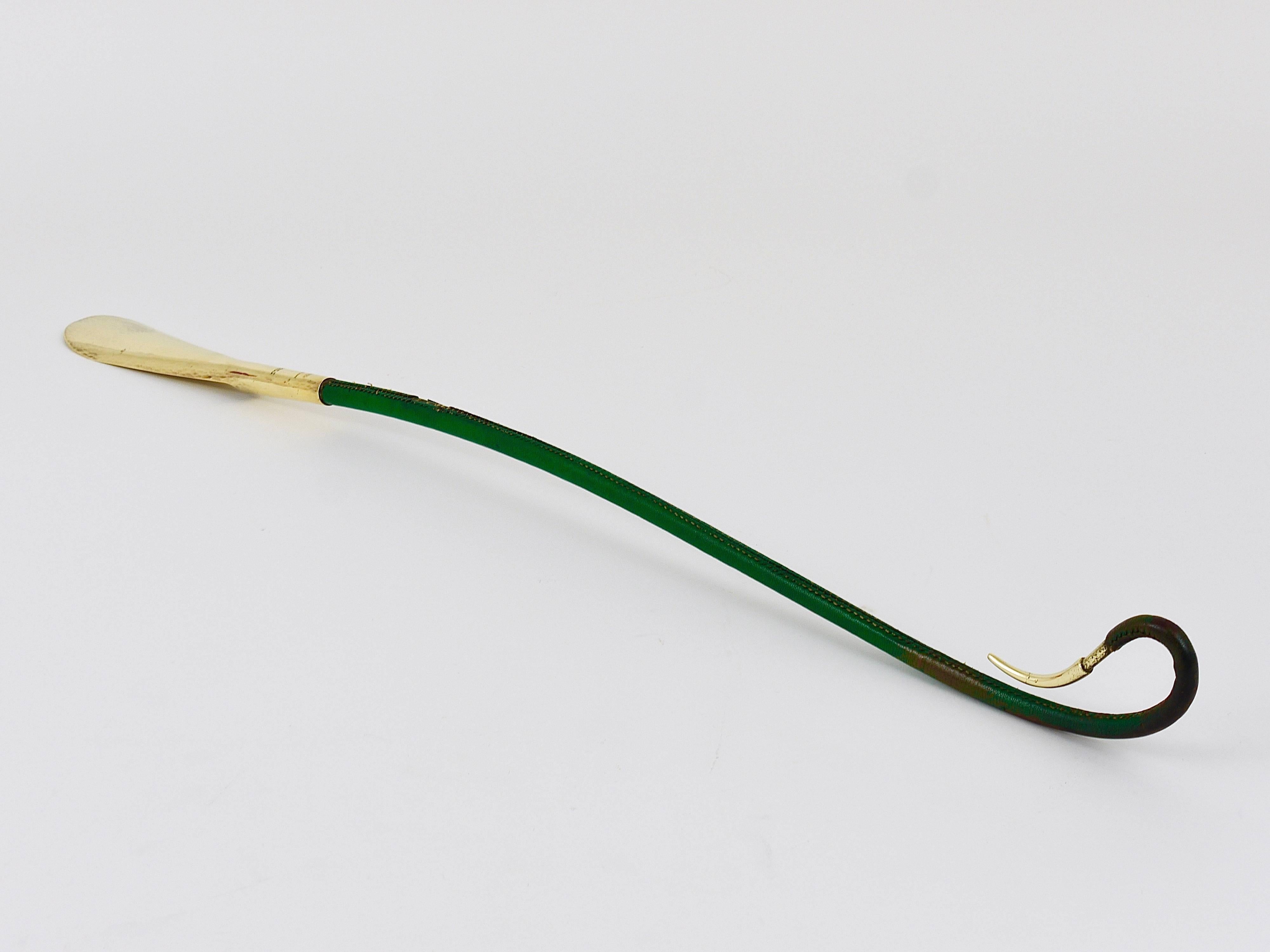 A rare and beautiful shoe horn, made of hammered brass, covered with green leather. Designed and executed by Workshop Carl Auböck in the 1950s. In good condition with signs of age on the leather.
Marked: Handmade Made in Austria Redl Wien.