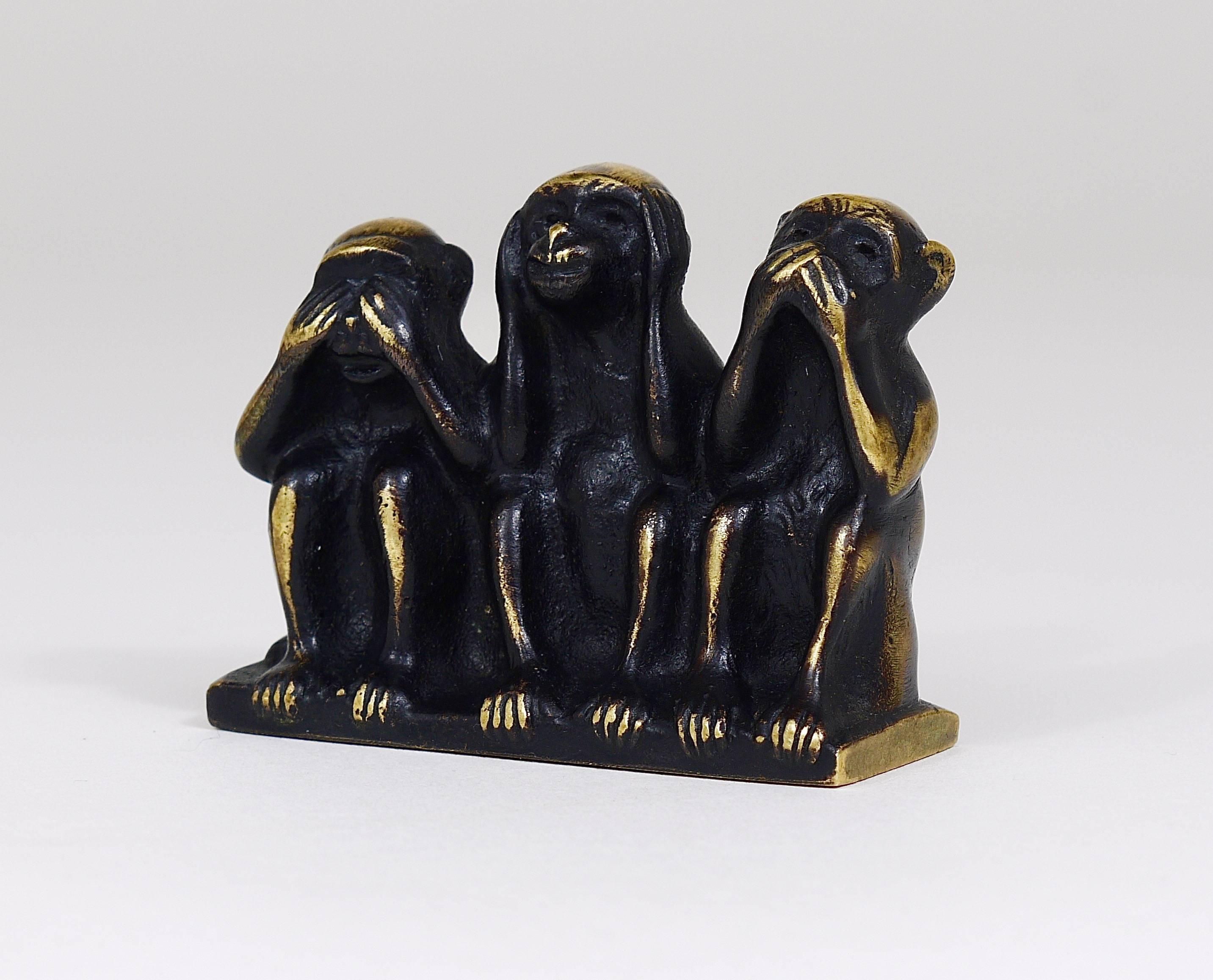 three wise monkey figurines