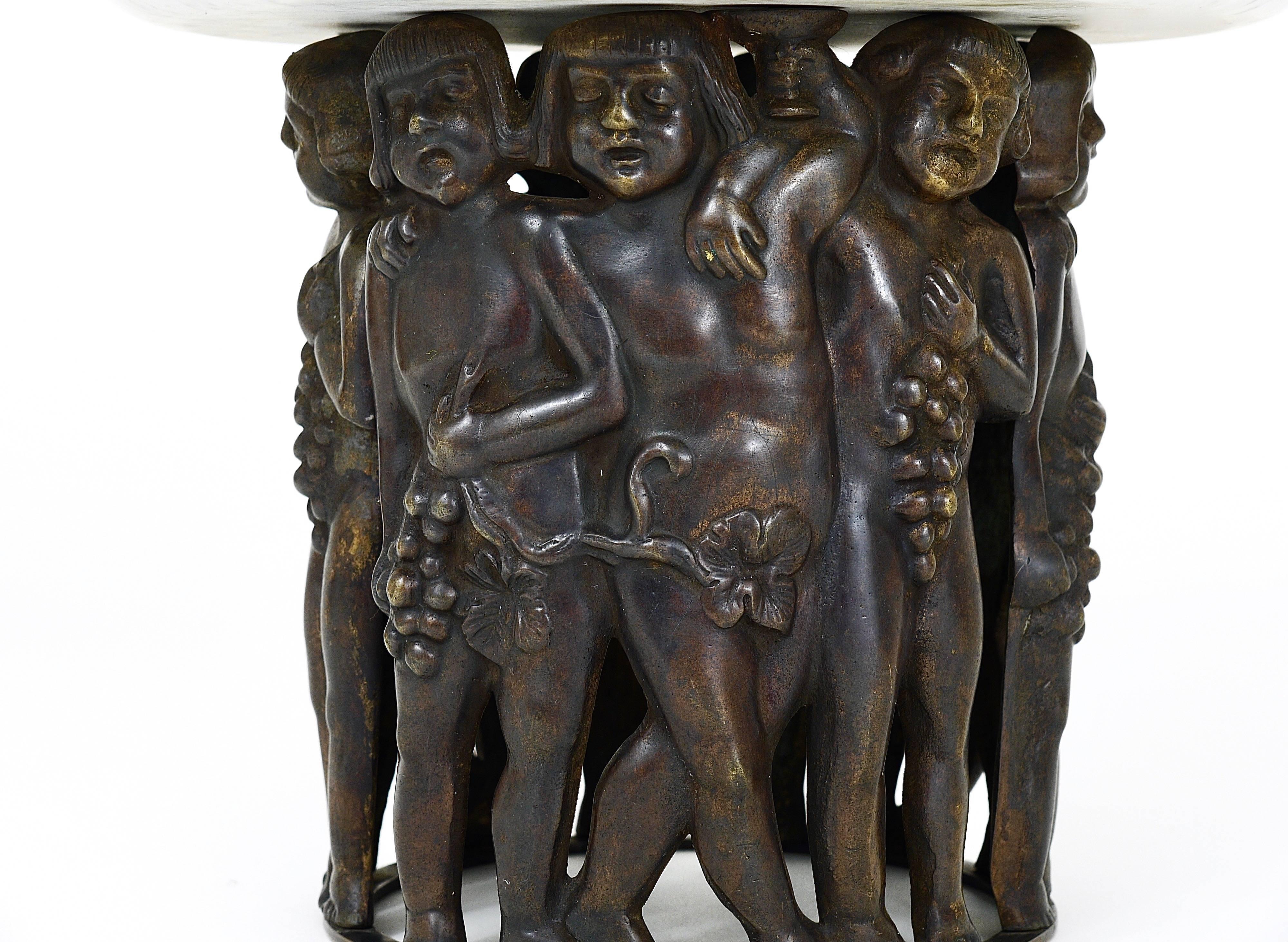 A delightful Art Nouveau sculptural centrepiece, executed in the 1920s in Austria. Made of patinated bronze, displaying boys with wine grapes with a marble top. Attributed to Gustav Gurschner. In very good condition.