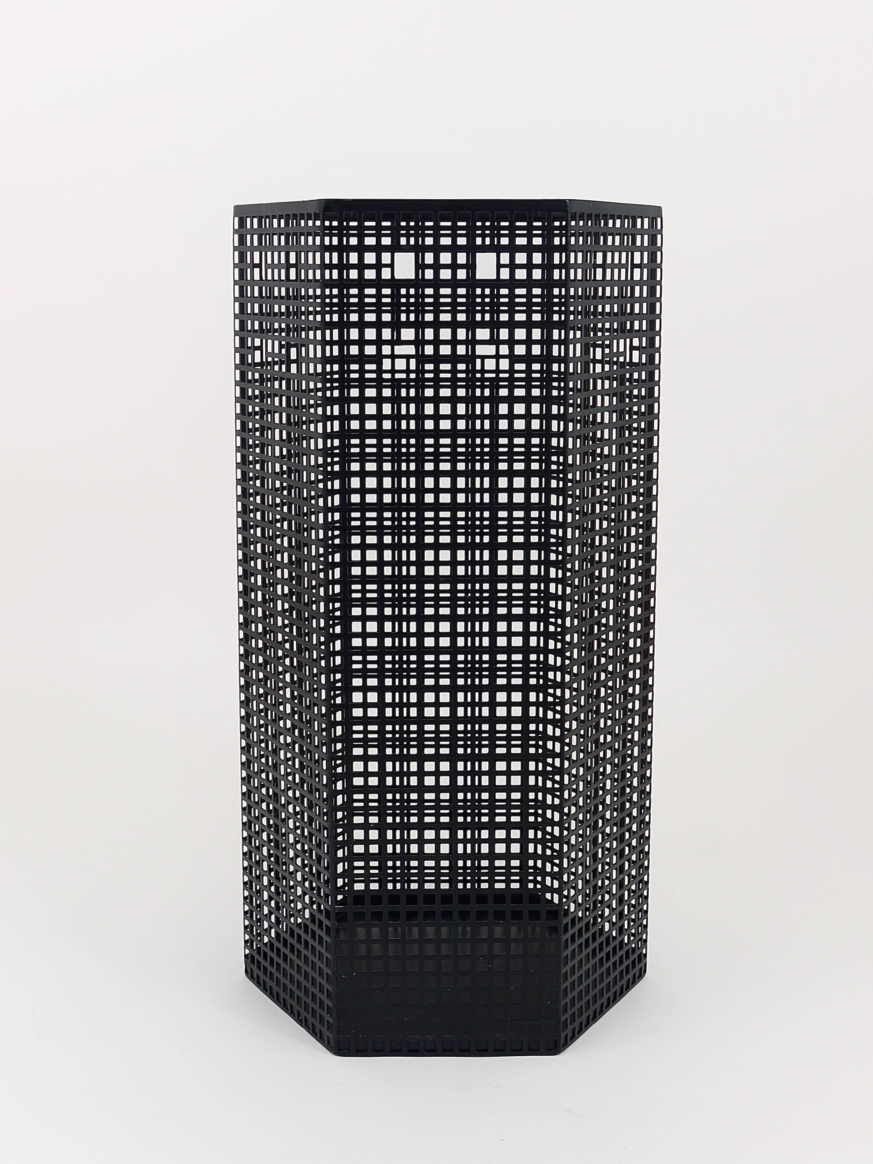 A beautiful umbrella stand or waste-paper, designed by Josef Hoffmann in 1905, manufactured as a Wiener Werkstatte Re-edition in the 1980s by Bieffeplast, Padua/Italy. Made of black enameled perforated metal. In excellent condition. Label on its
