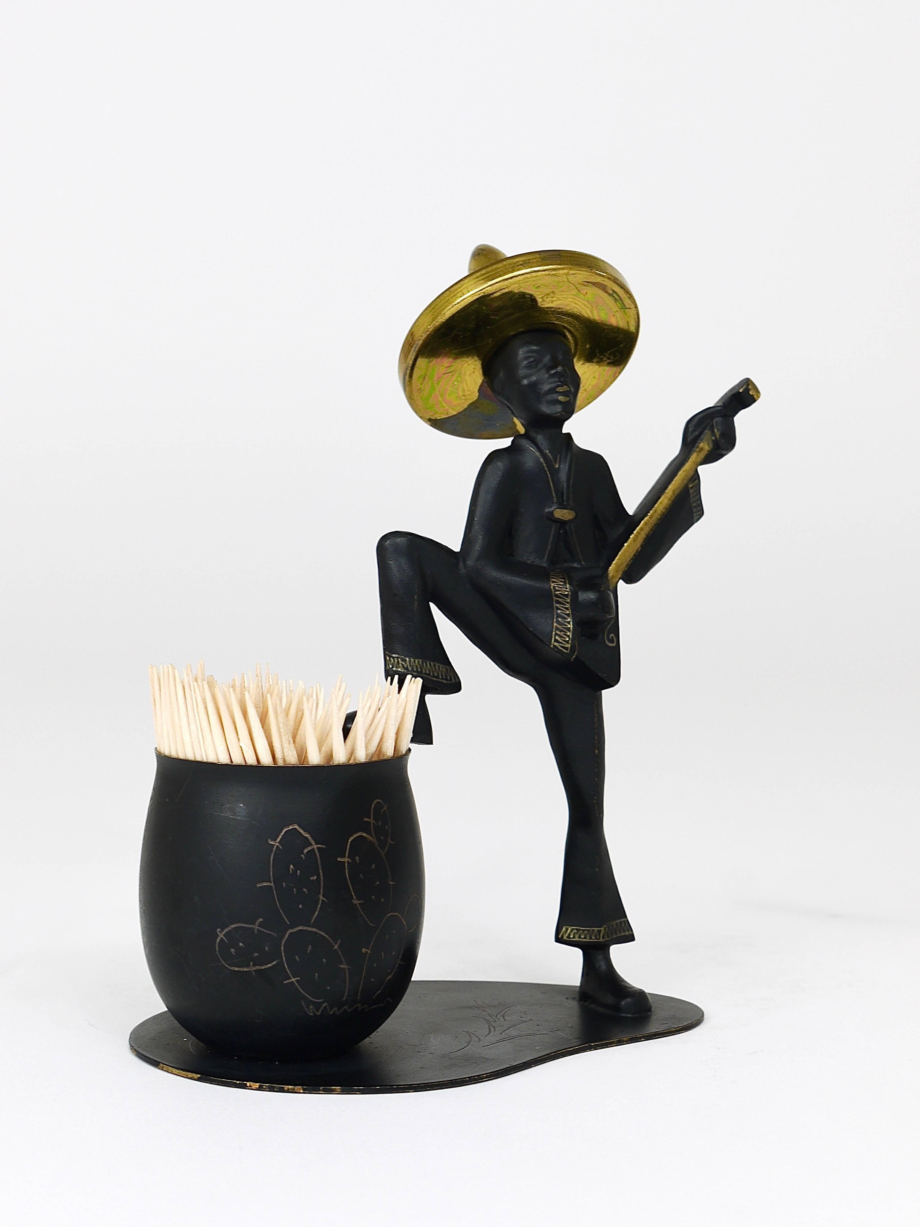 A toothpick holder displaying a Mexican playing guitar. Executed by Hertha Baller in Austria in the 1950s. Made of brass, in excellent condition.