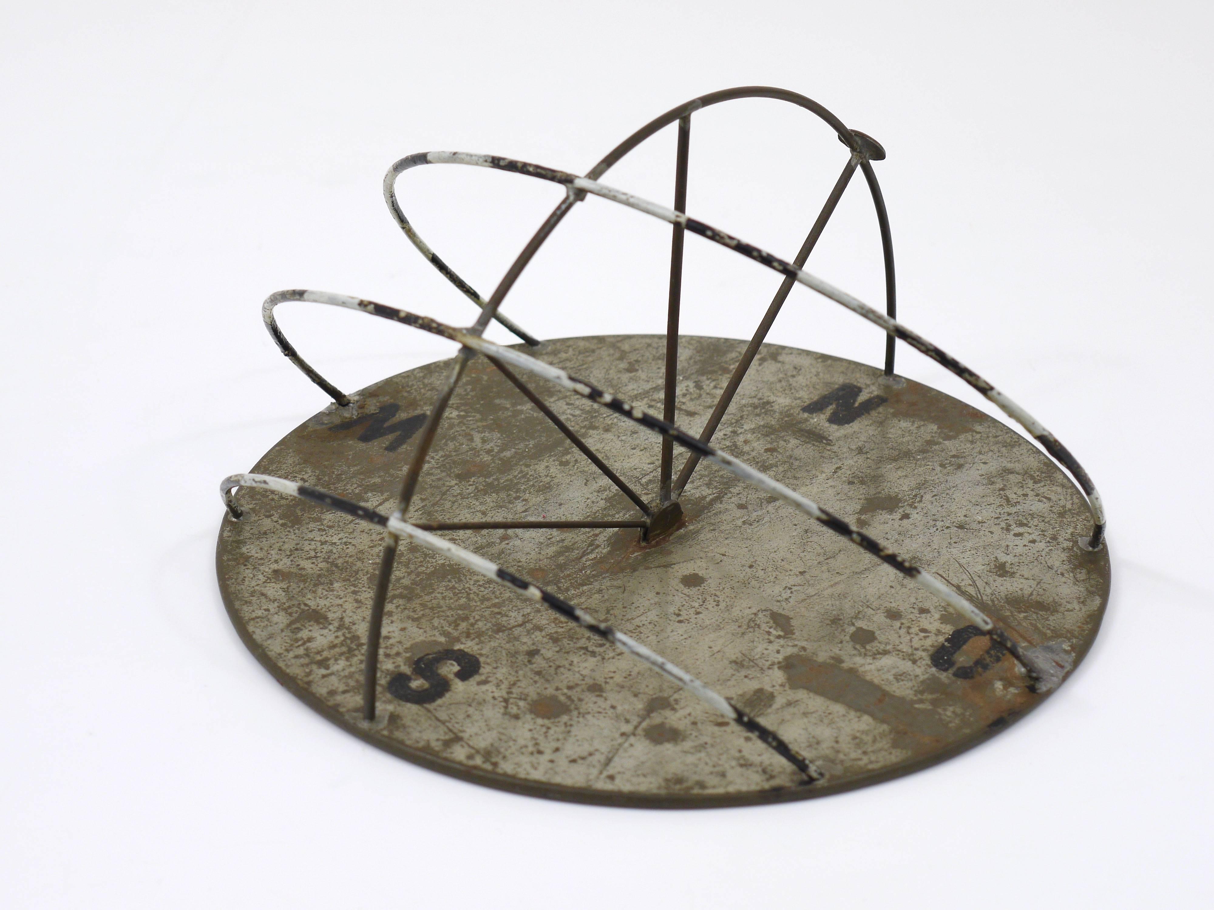A beautiful sundial, made of iron, made in Germany in the 1950s with nice patina.