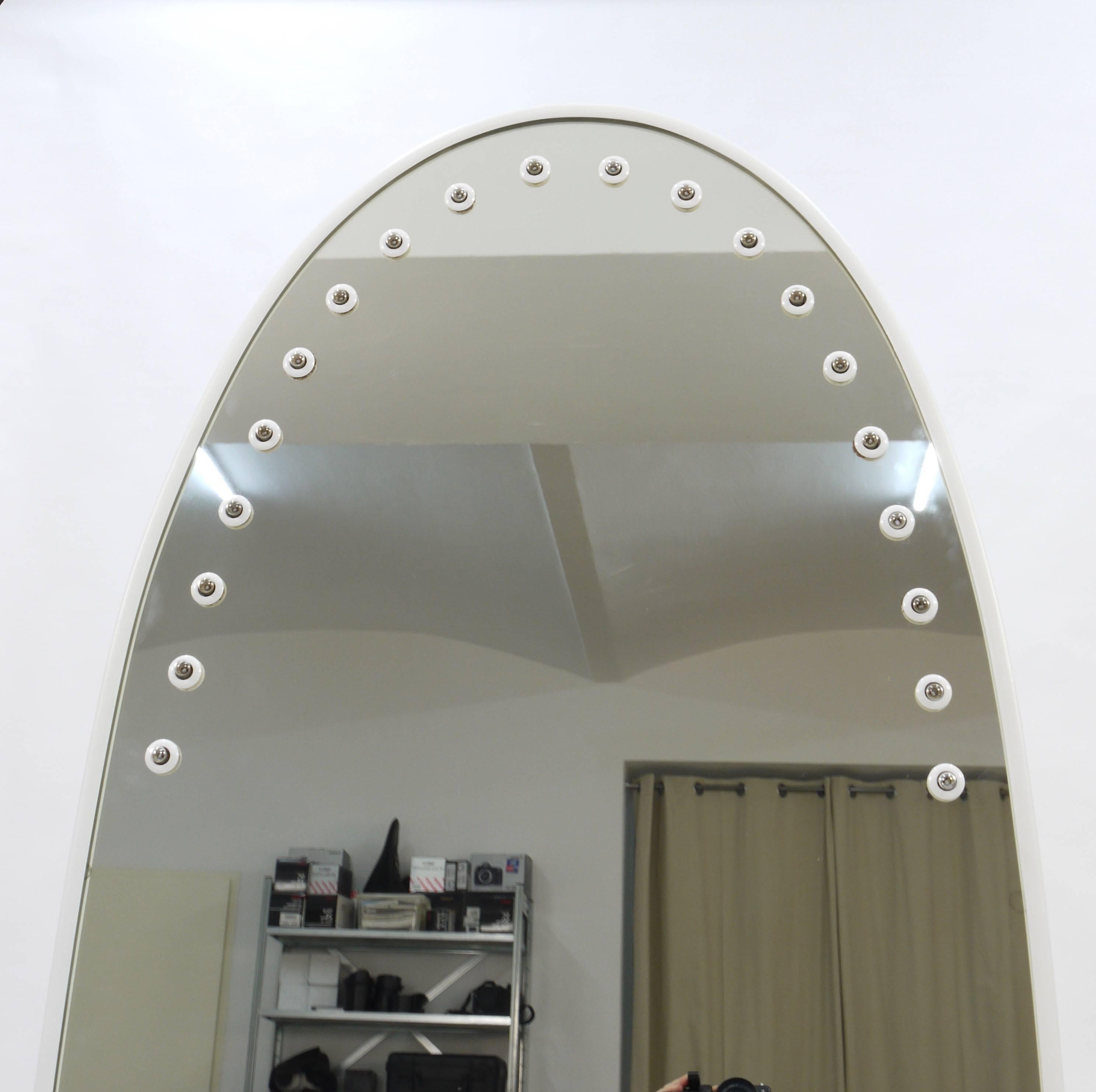An elliptical full-length wall mirror with a white metal frame and integrated illumination, designed by Gino Sarfatti, executed by Arteluce, Italy in the 1970s. Excellent condition.